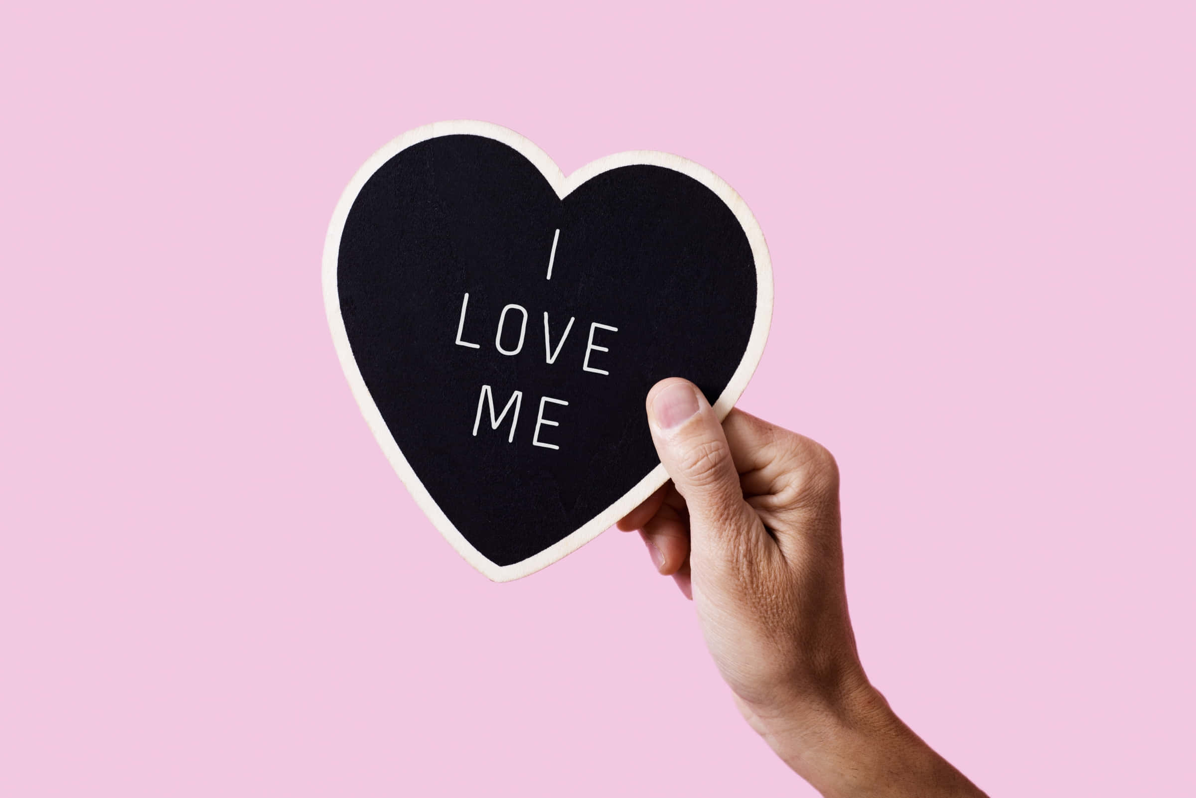 black heart-shaped chalkboard, white letters spelling 'I LOVE ME', soft pink background, Full HD Desktop Wallpaper