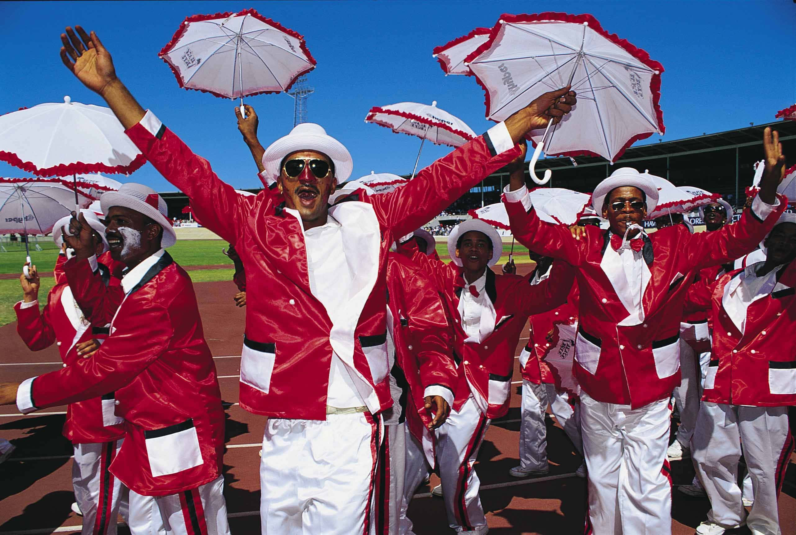 African culture, red and white uniforms, white umbrellas, 2K Desktop Wallpaper
