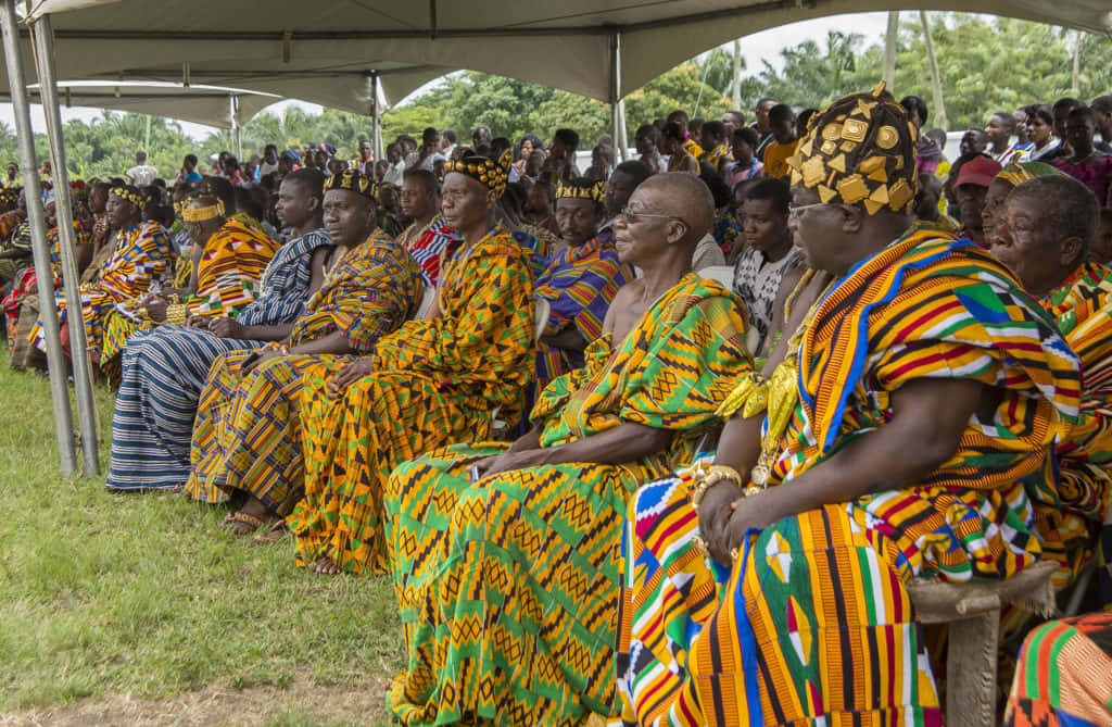 vibrant traditional African attire, white canopy, grassy outdoor setting, SD Desktop Wallpaper