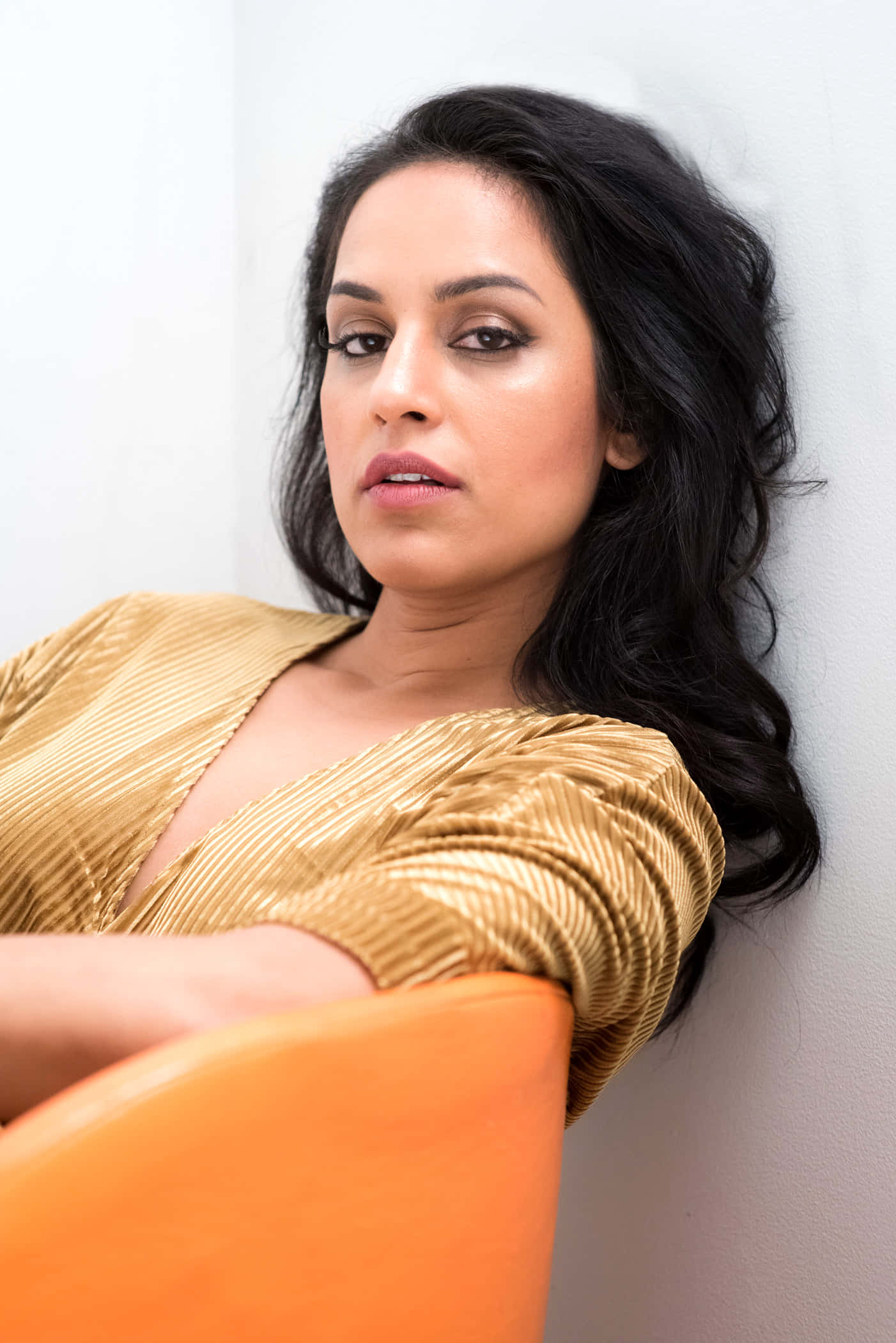 Agam Darshi, golden pleated top, orange chair, Full HD Phone Wallpaper