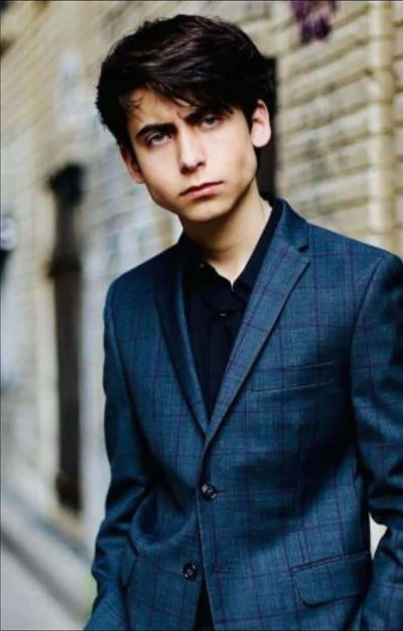 Aidan Gallagher, blue plaid suit, blurred brick wall, SD Phone Wallpaper