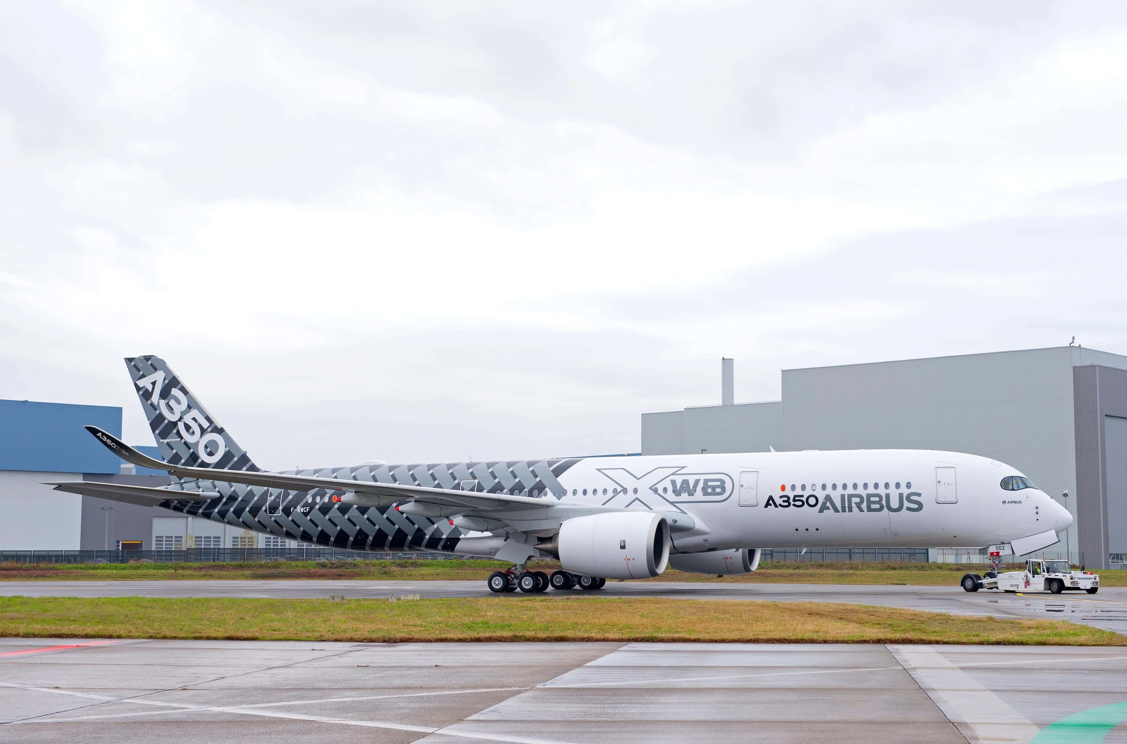 Airbus A350, geometric black and white livery, wet tarmac, 2K Desktop Wallpaper