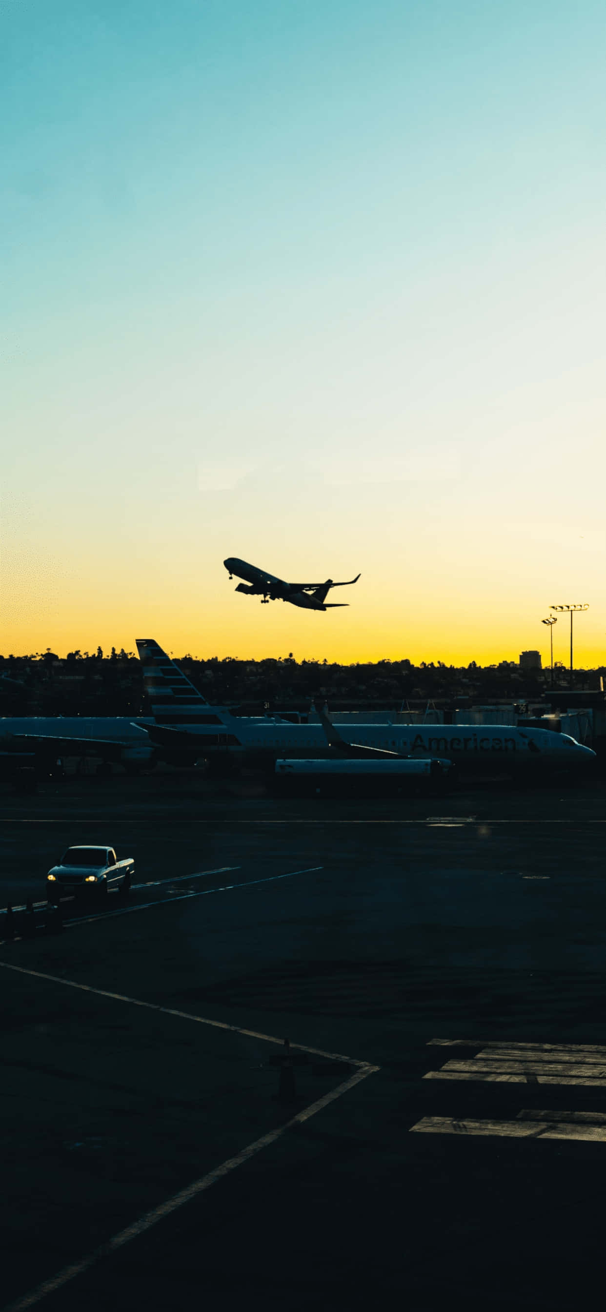 sunrise takeoff silhouette, golden sunset sky, airport tarmac, 2K Phone Wallpaper