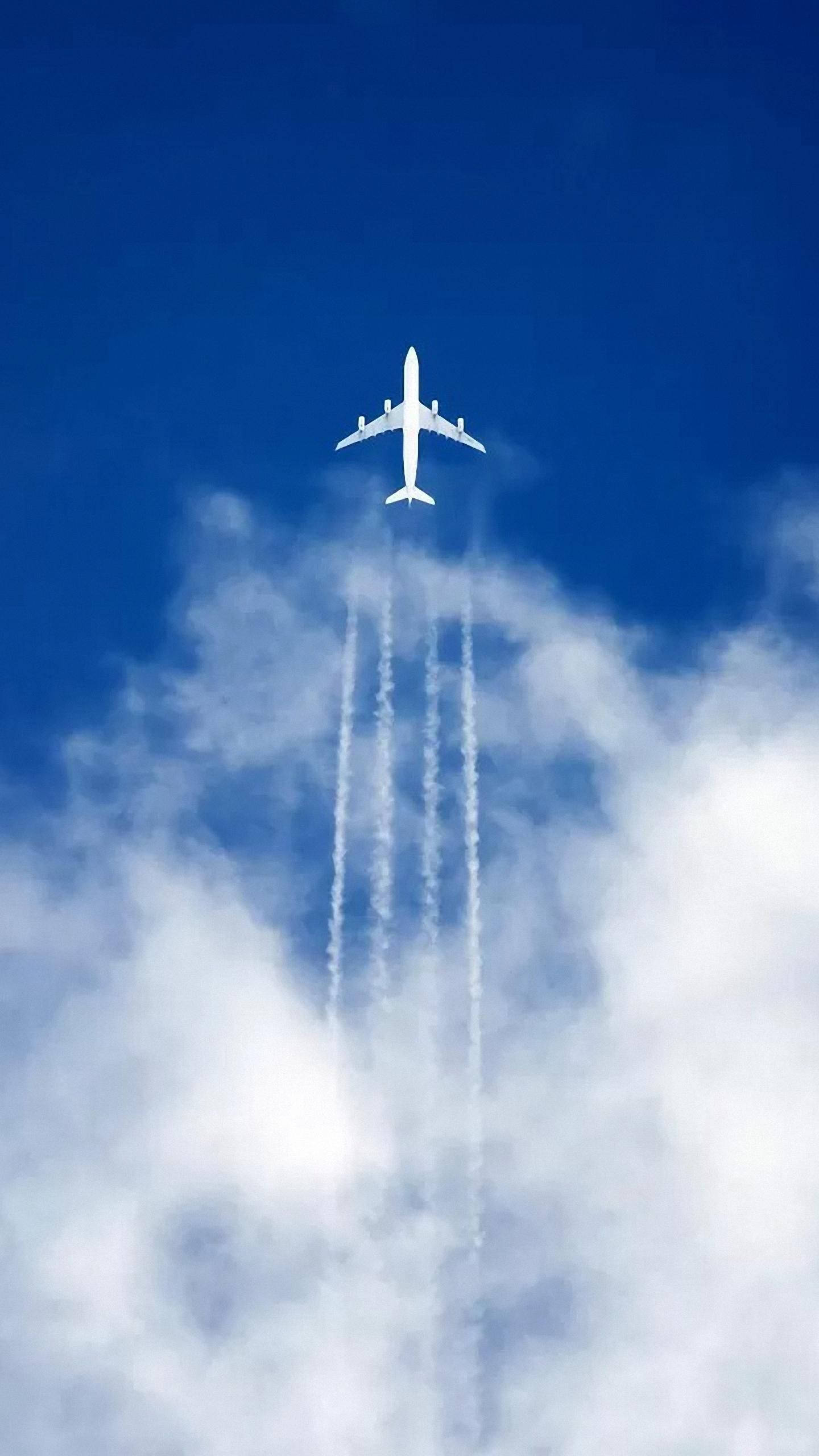 white airplane, vibrant blue sky, fluffy white clouds, 2K Phone Wallpaper