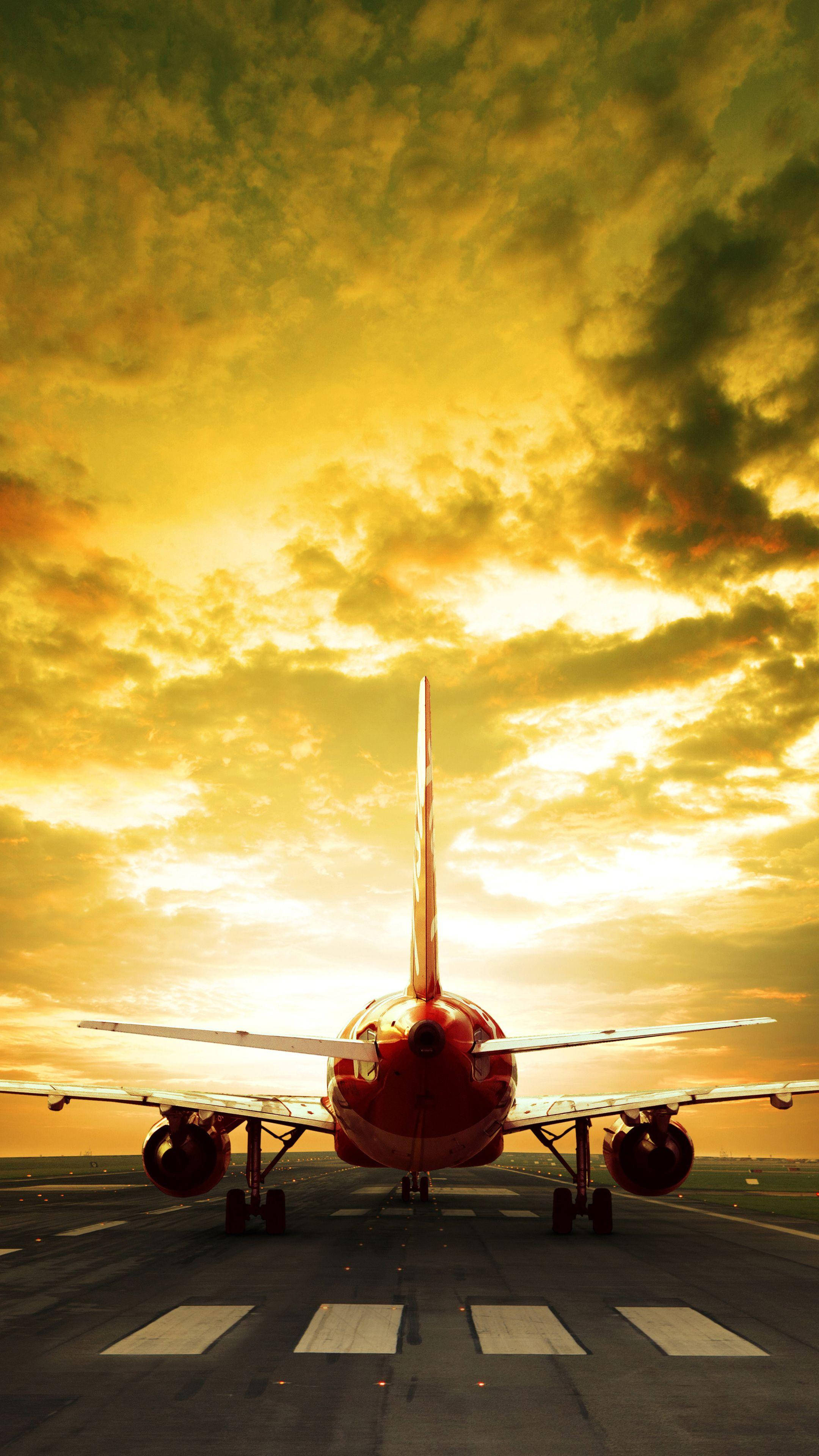 red jet, runway, dramatic golden sunset sky, 4K Phone Wallpaper