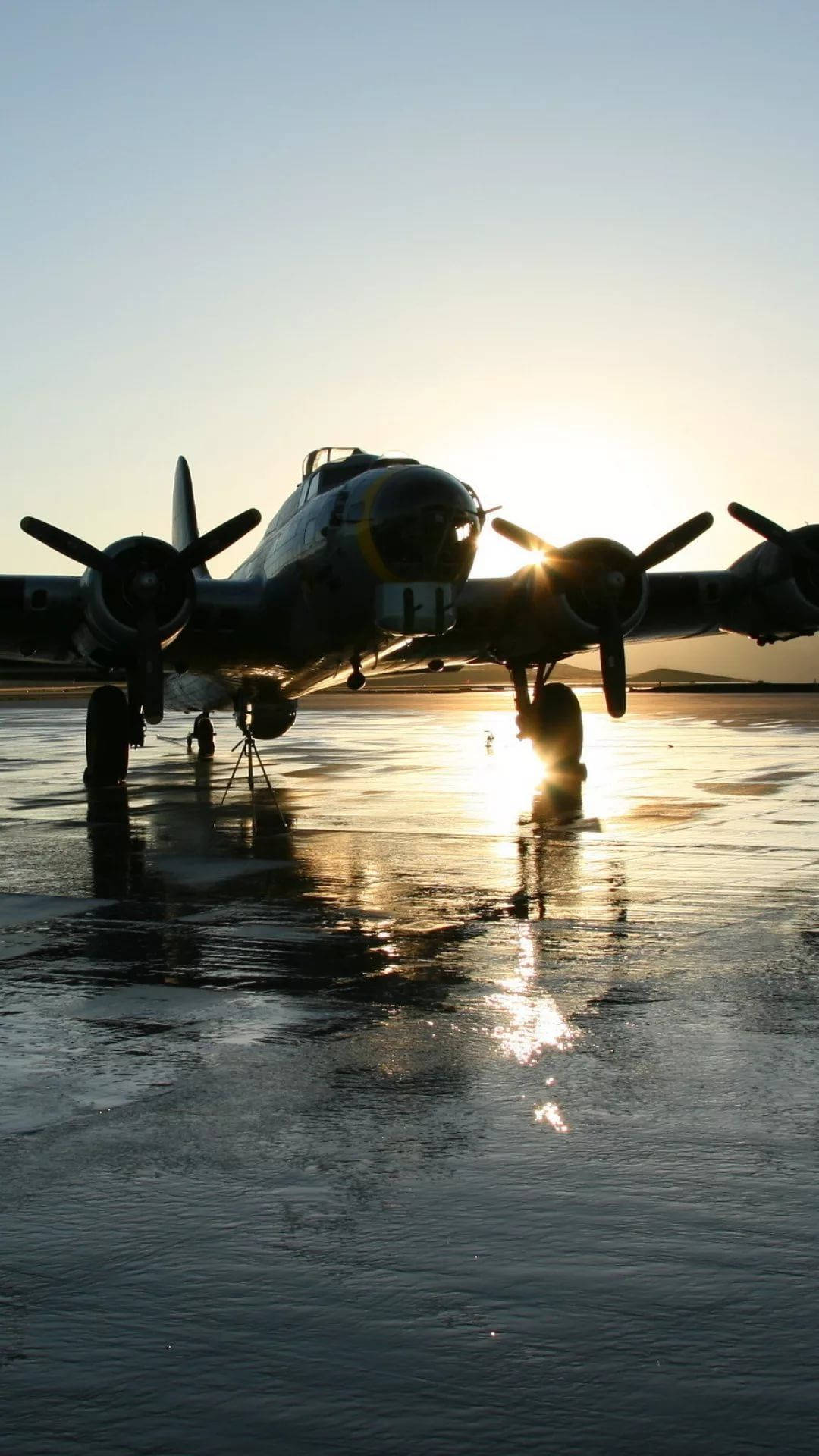 vintage propeller plane, glowing sunset, wet tarmac, Full HD Phone Wallpaper