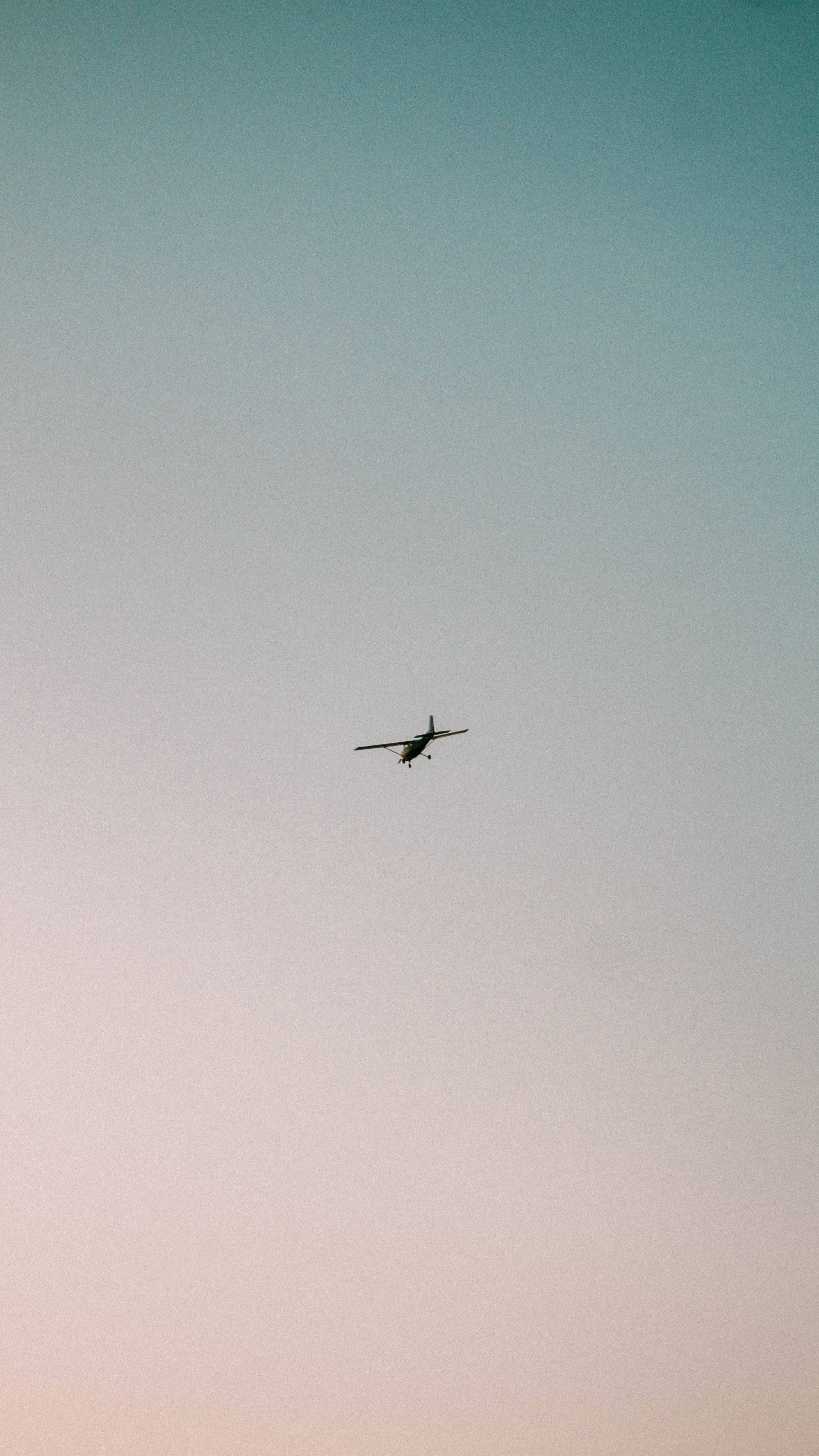 airplane, teal to pink gradient sky, dusk, 5K Phone Wallpaper