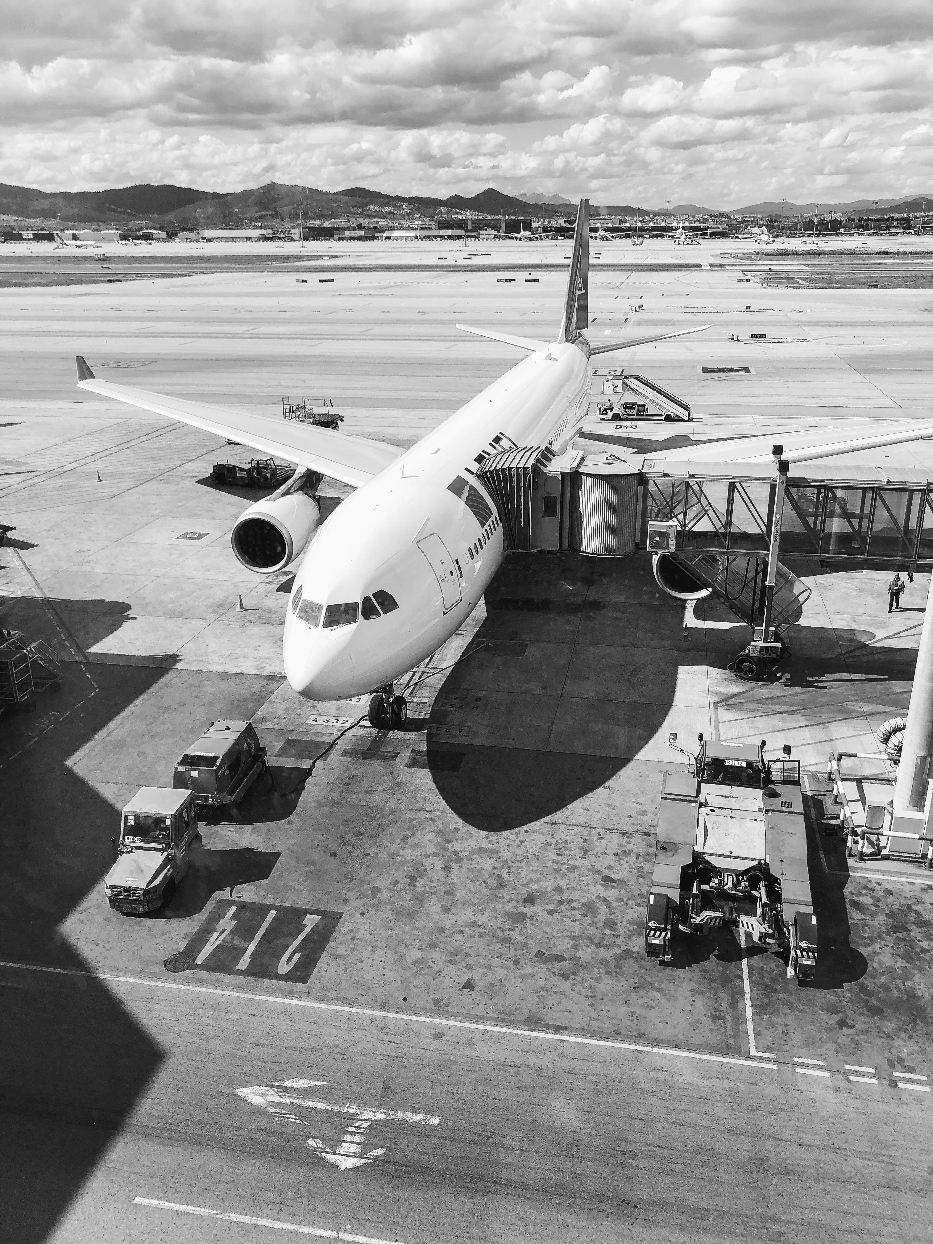black and white, large passenger jet, airport gate, 4K Phone Wallpaper