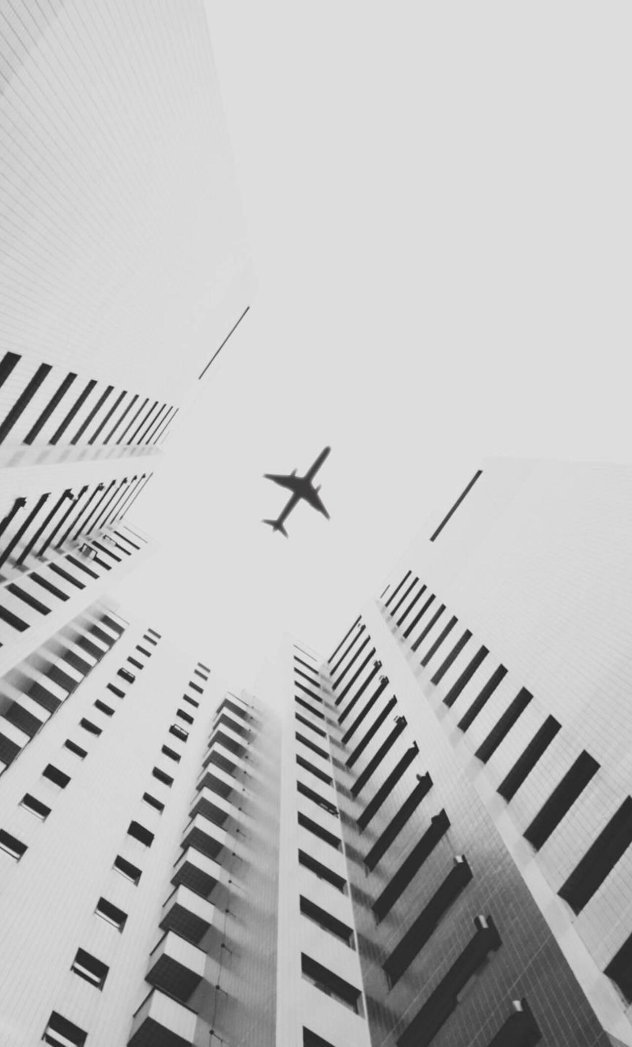 jet, towering skyscrapers, geometric facades, Full HD Phone Wallpaper