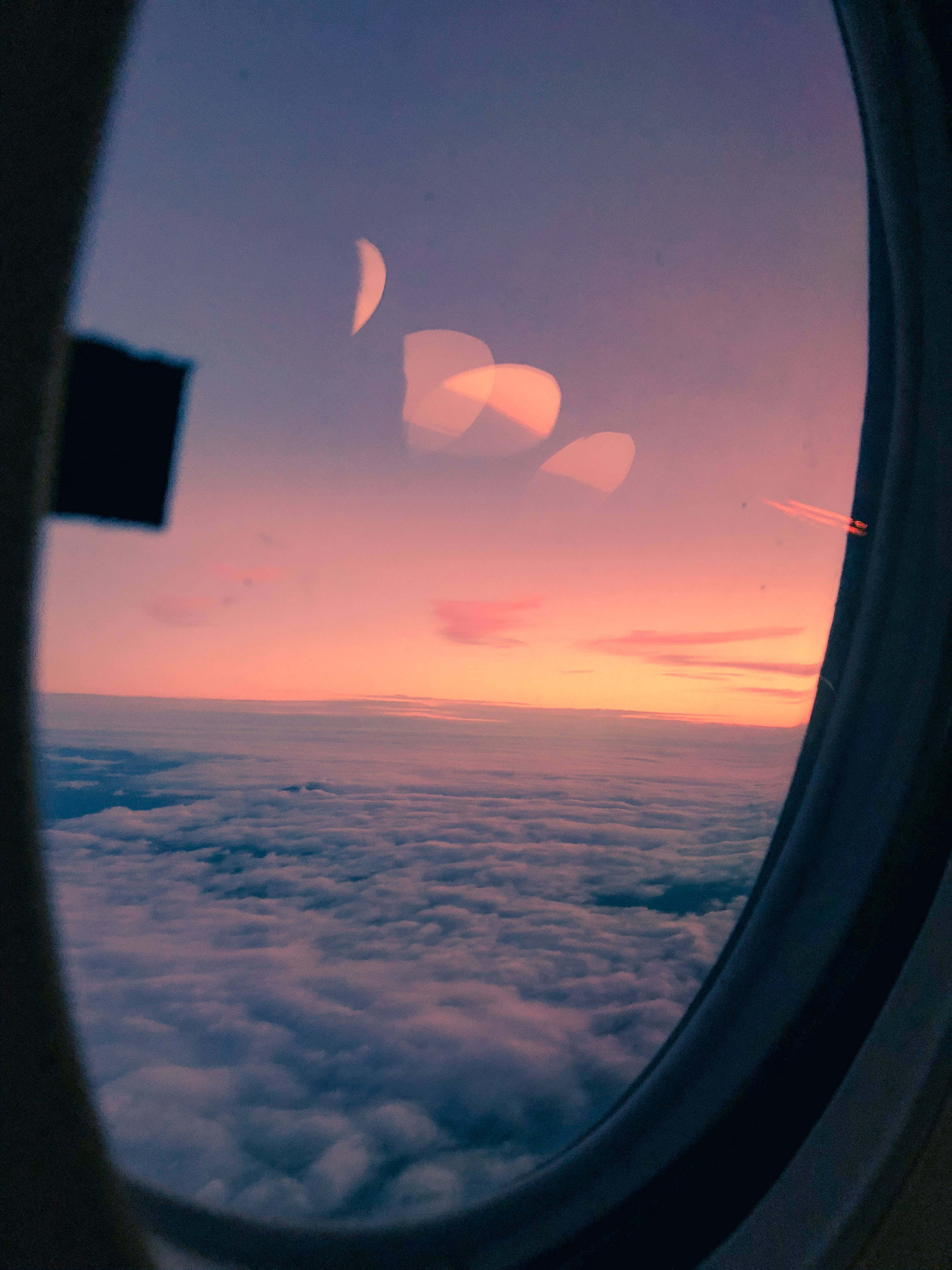 Airplane Window, pink and purple sunset, endless clouds, 4K Phone Wallpaper