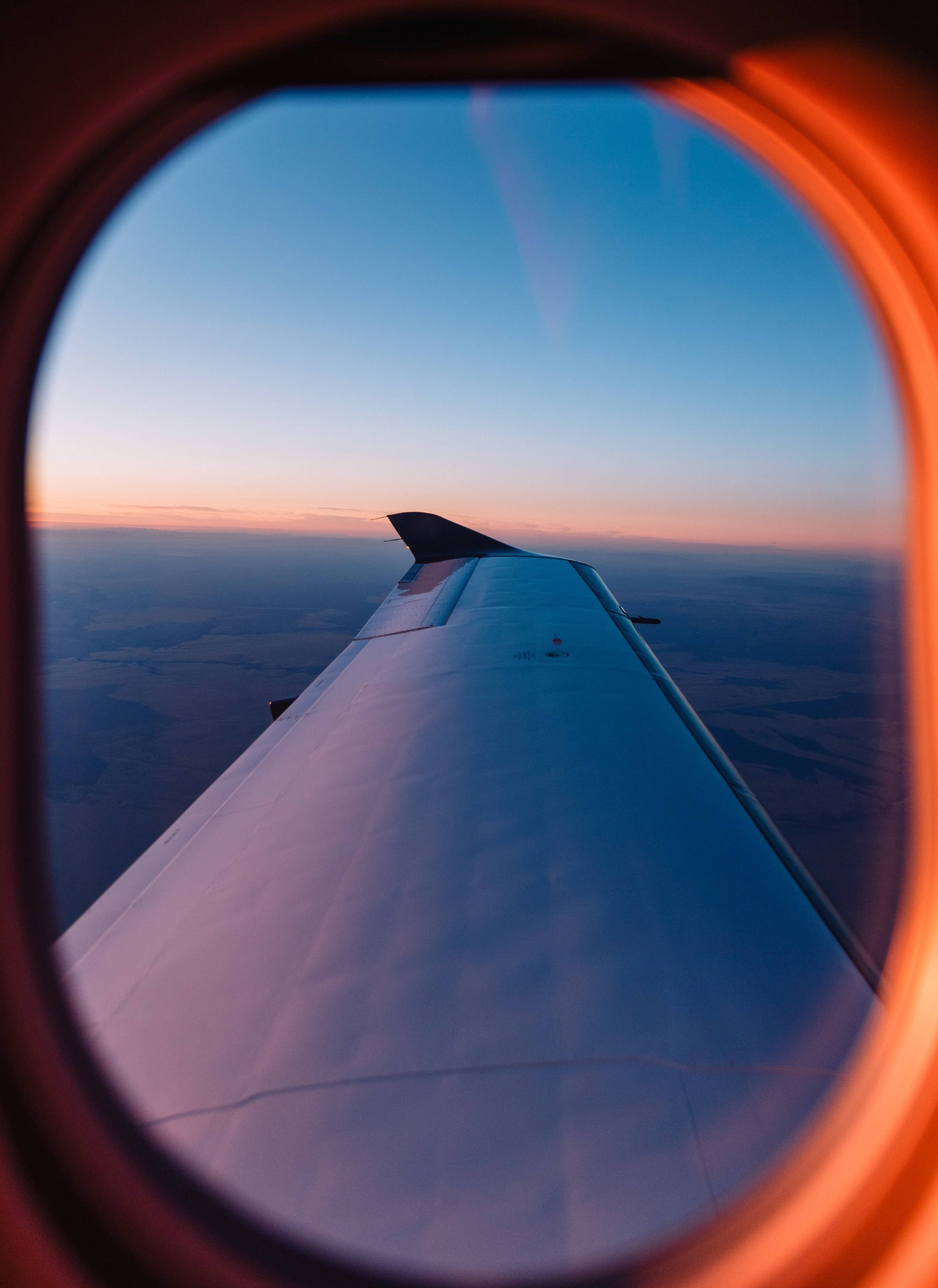 airplane window, circular window, vibrant sunset, 2K Phone Wallpaper