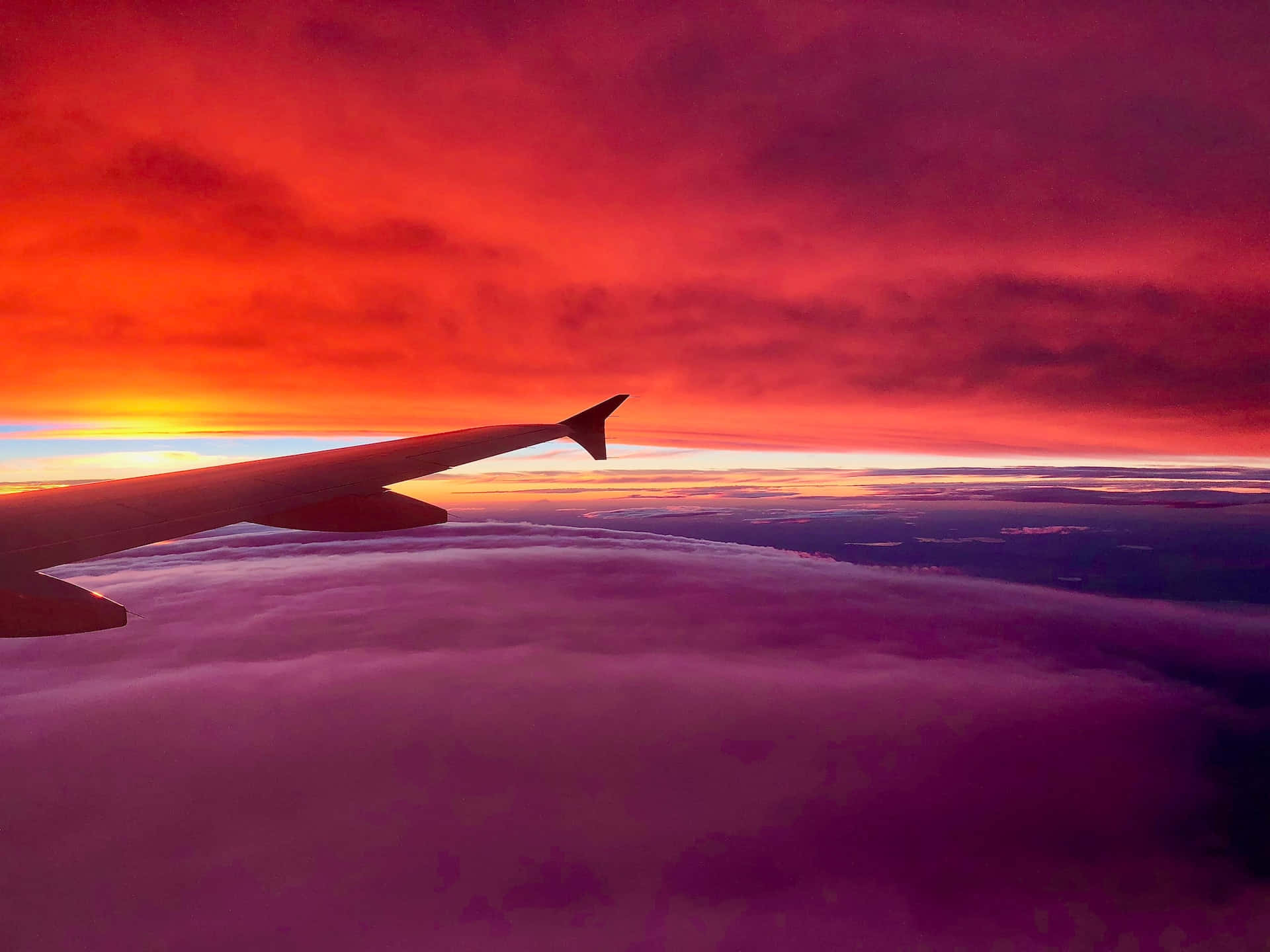 Aircraft wing, fiery sunset sky, sea of purple clouds, Full HD Desktop Wallpaper