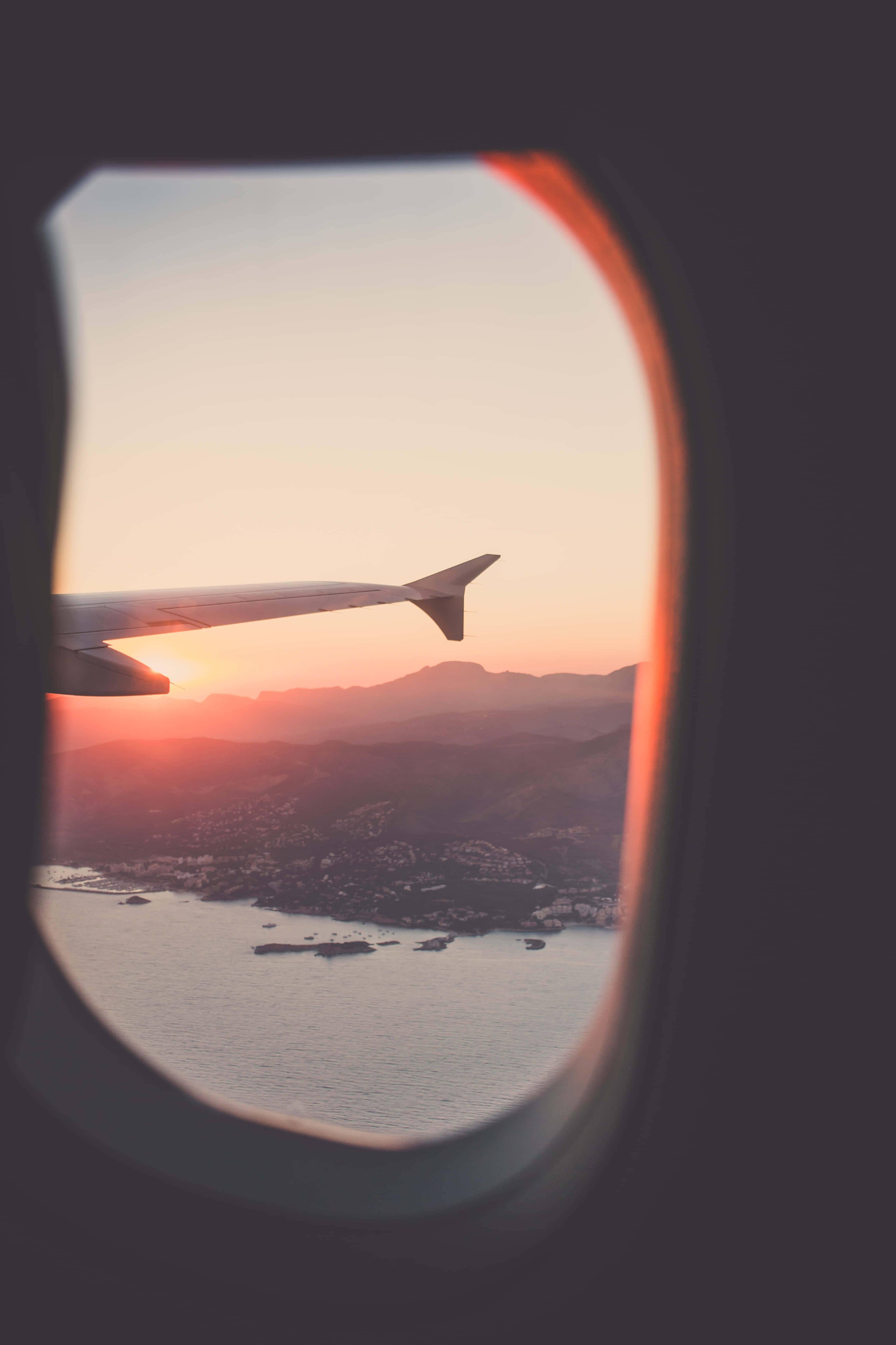aircraft wing silhouette, sunset, coastal mountains, 5K Phone Wallpaper