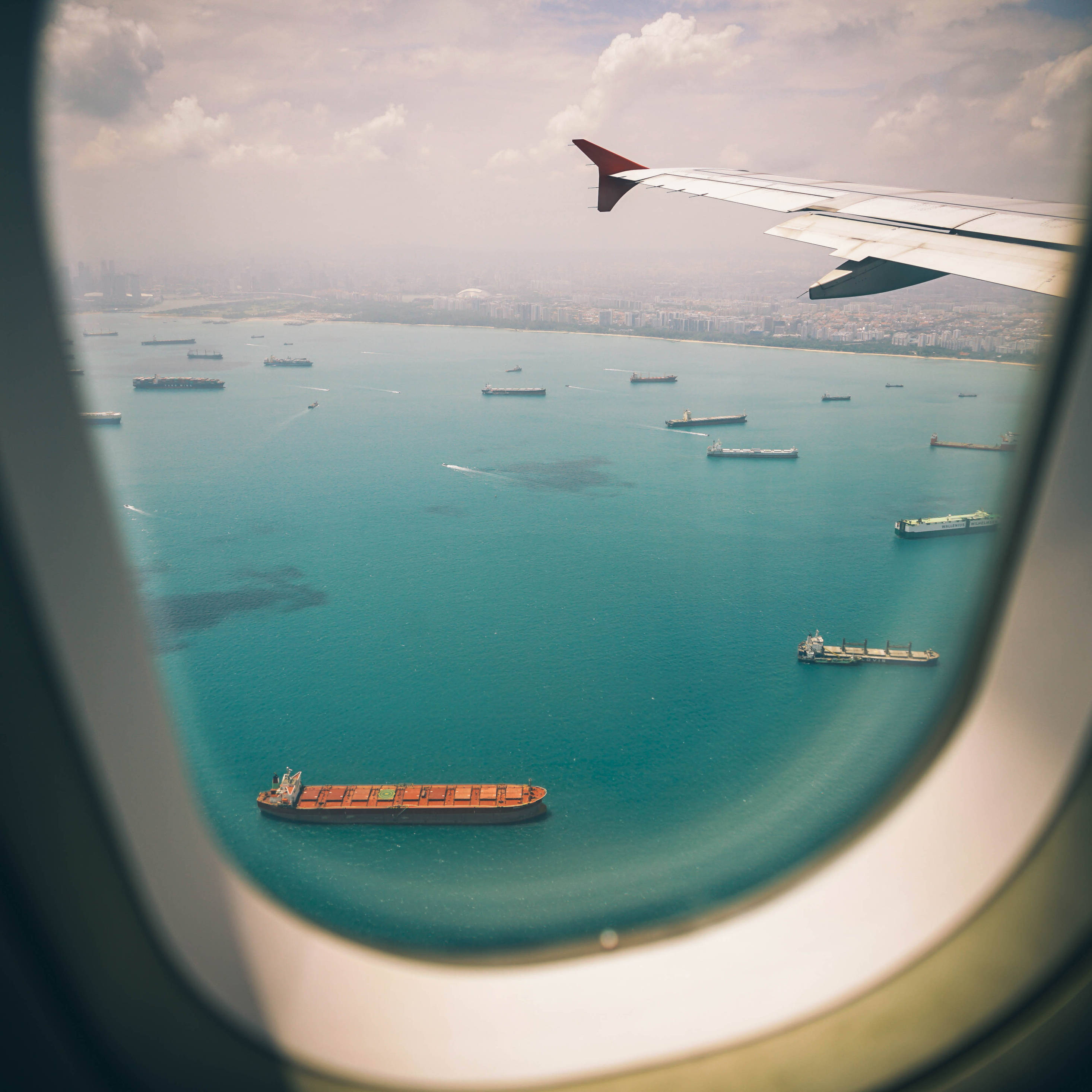 airplane window, turquoise sea, cargo ships, 2K Desktop Wallpaper