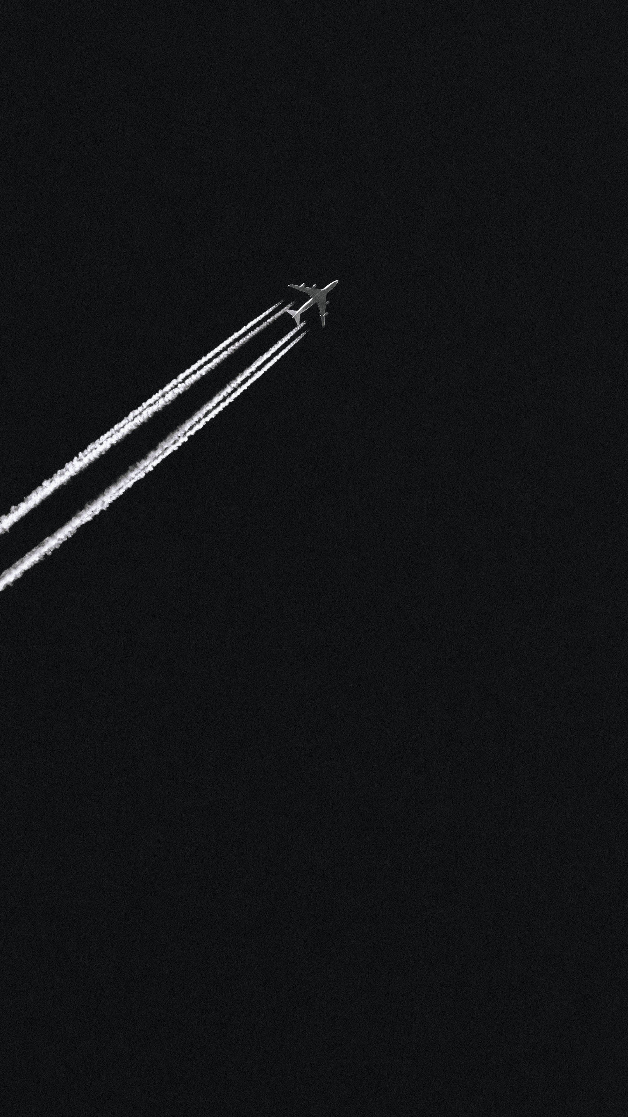 minimalist airplane, contrails, deep black night sky, 4K Phone Wallpaper