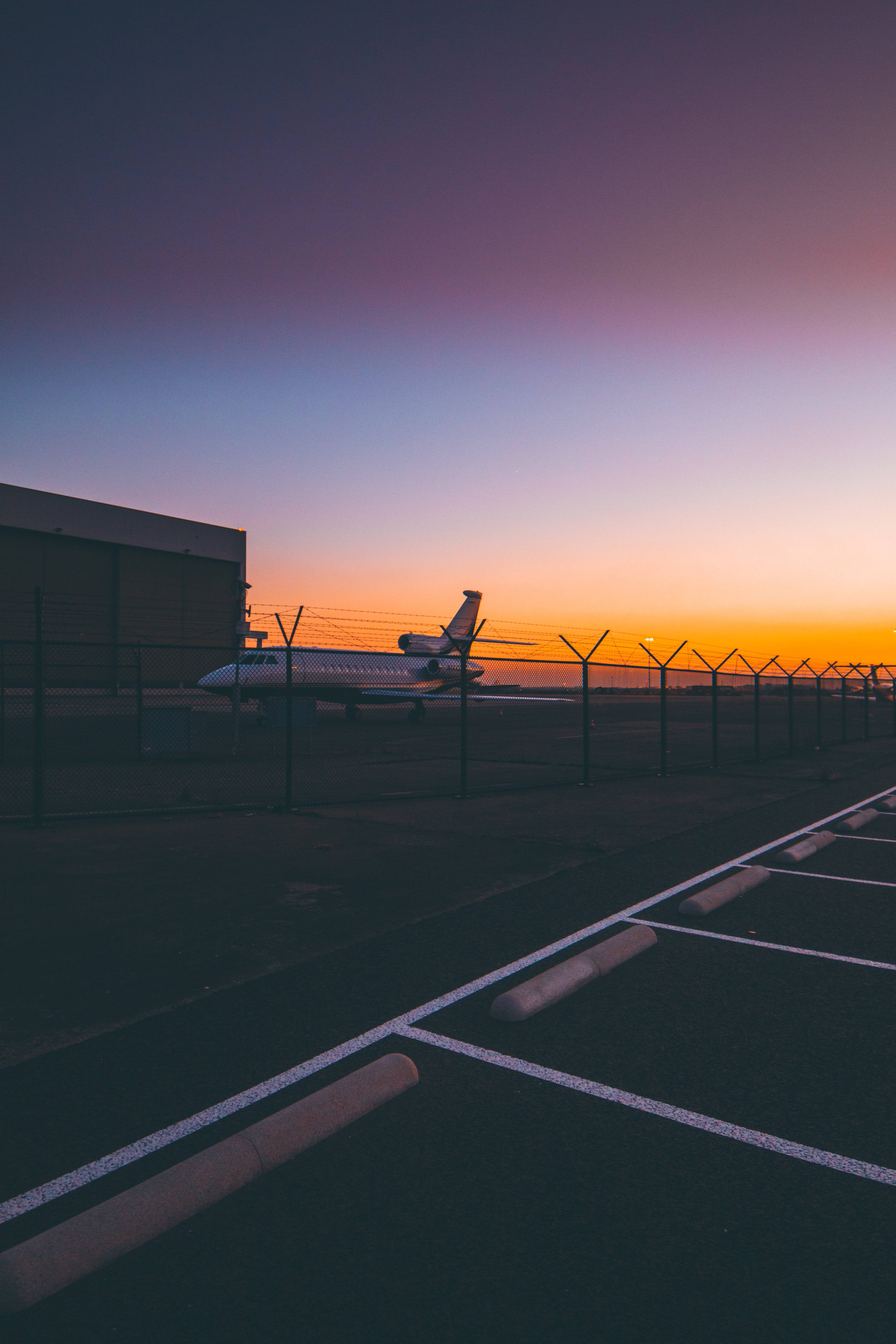 private jet, airport ramp, dusk, 4K Phone Wallpaper