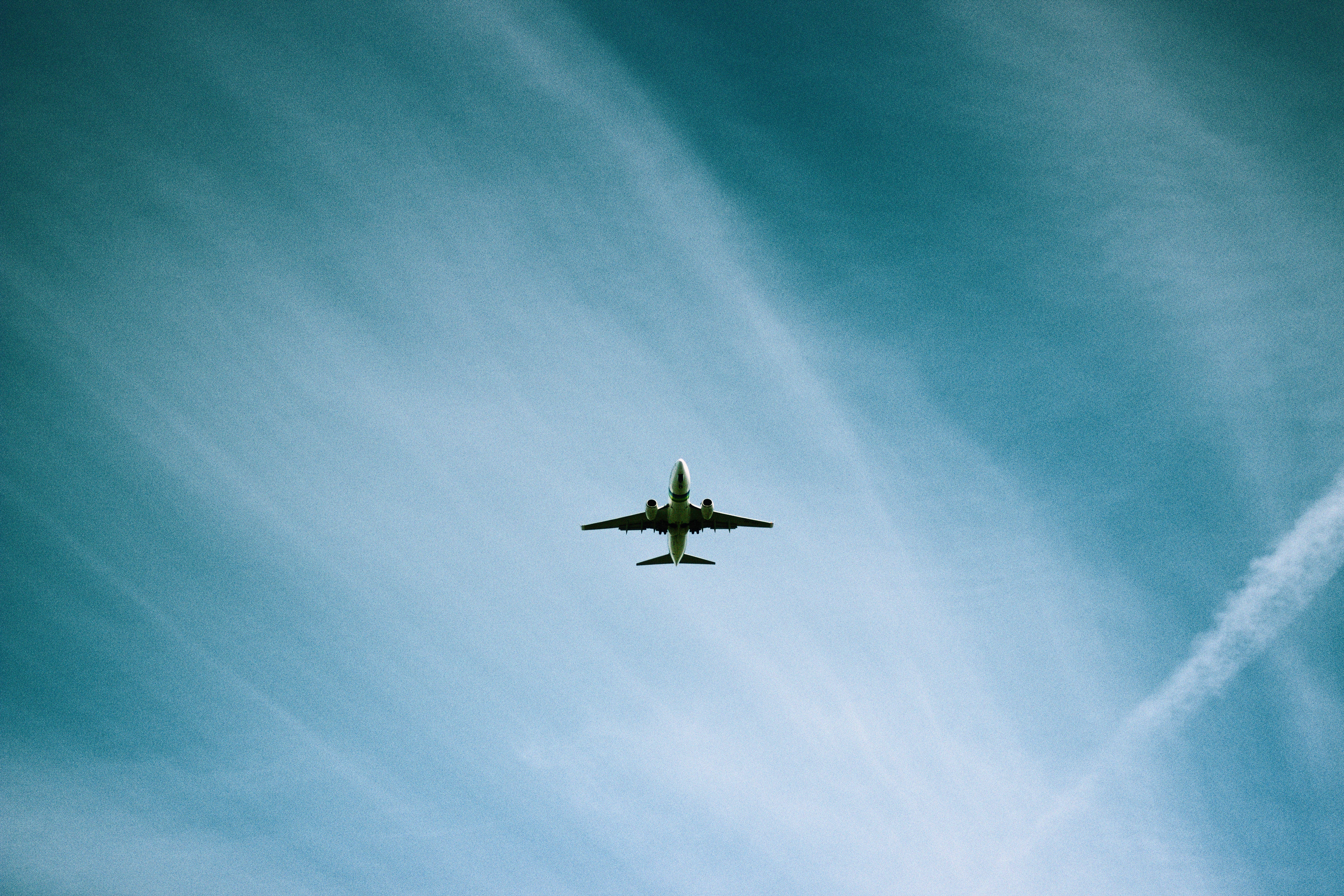 commercial airplane, vast blue sky, wispy white clouds, 5K Desktop Wallpaper
