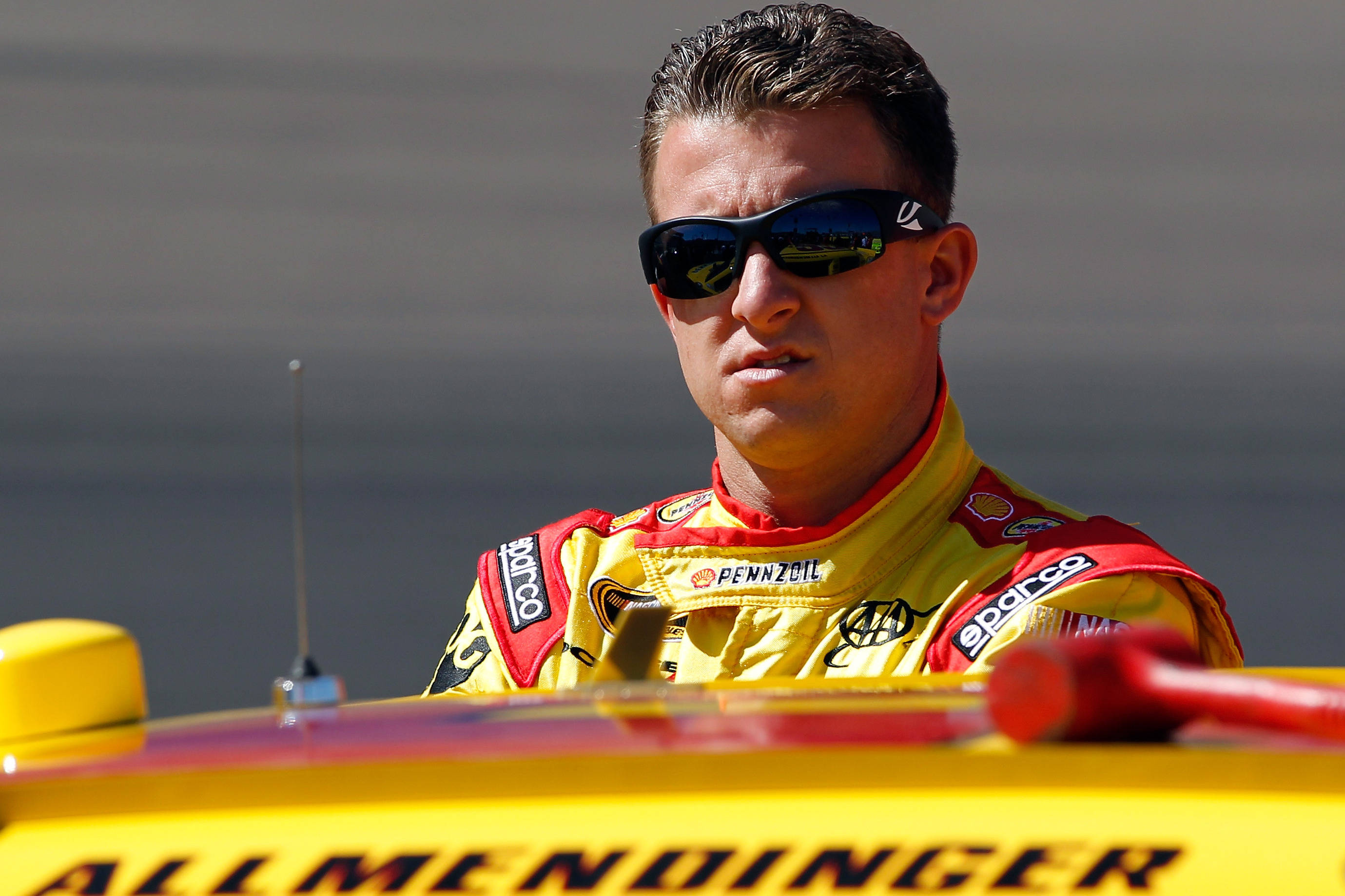 AJ Allmendinger, yellow and red racing suit, bright yellow race car, 2K Desktop Wallpaper