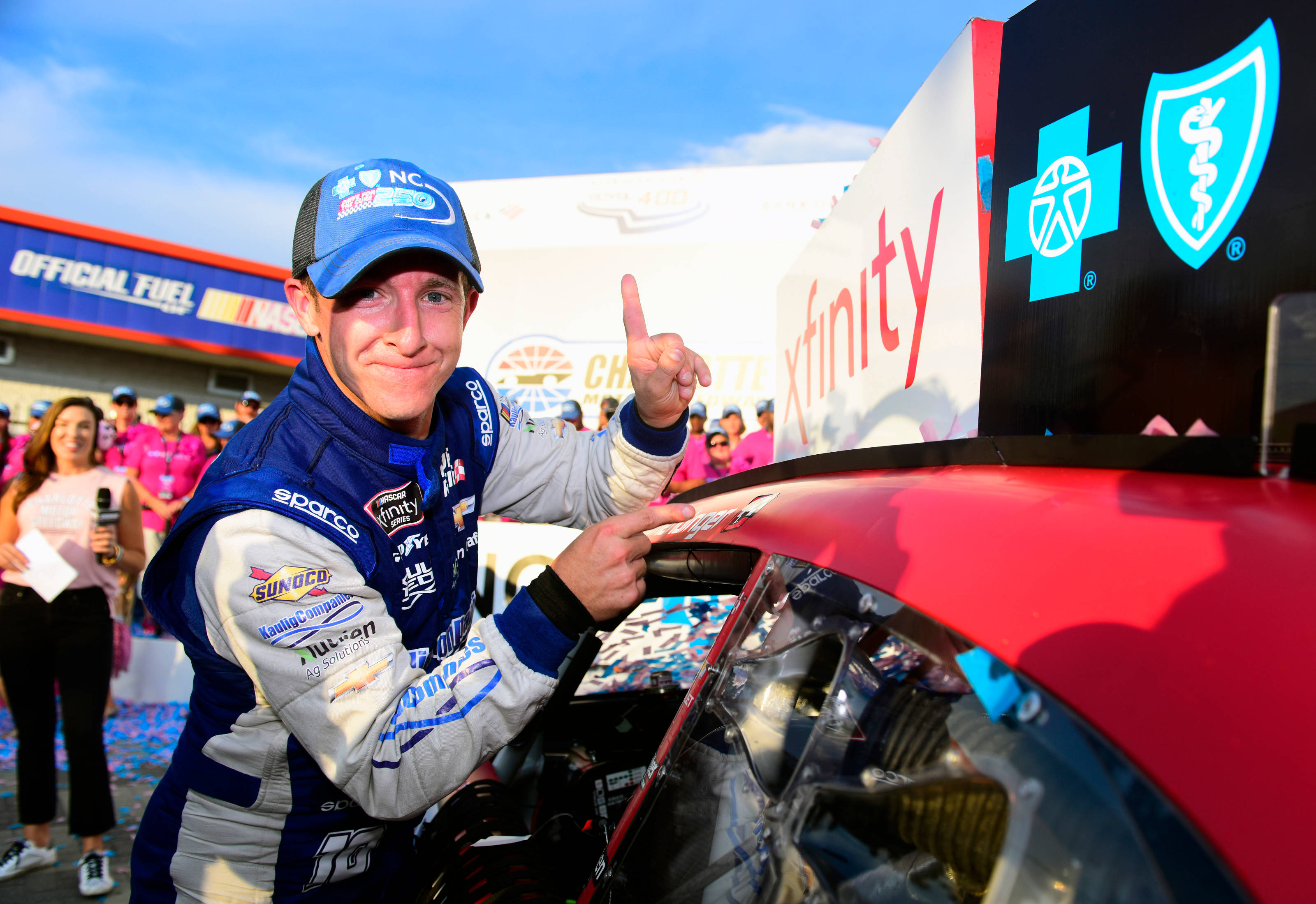 AJ Allmendinger, blue and white racing suit, red race car, 2K Desktop Wallpaper