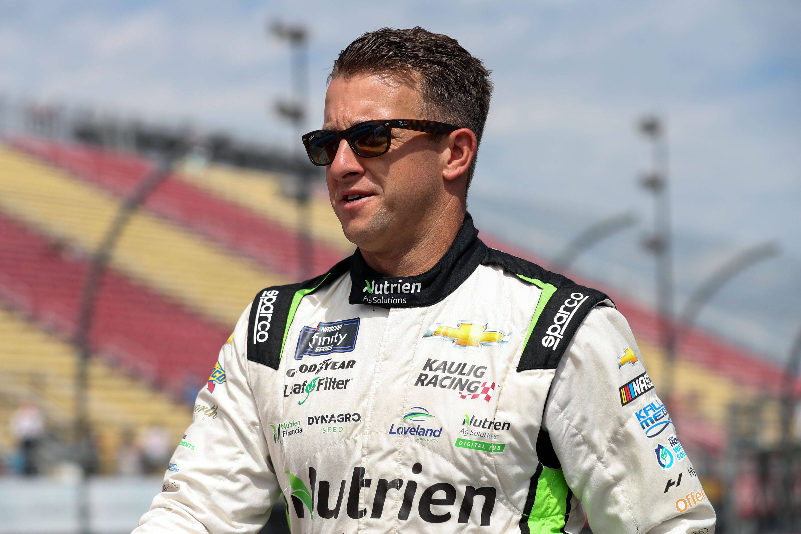 AJ Allmendinger, white racing suit, sponsor logos, 2K Desktop Wallpaper