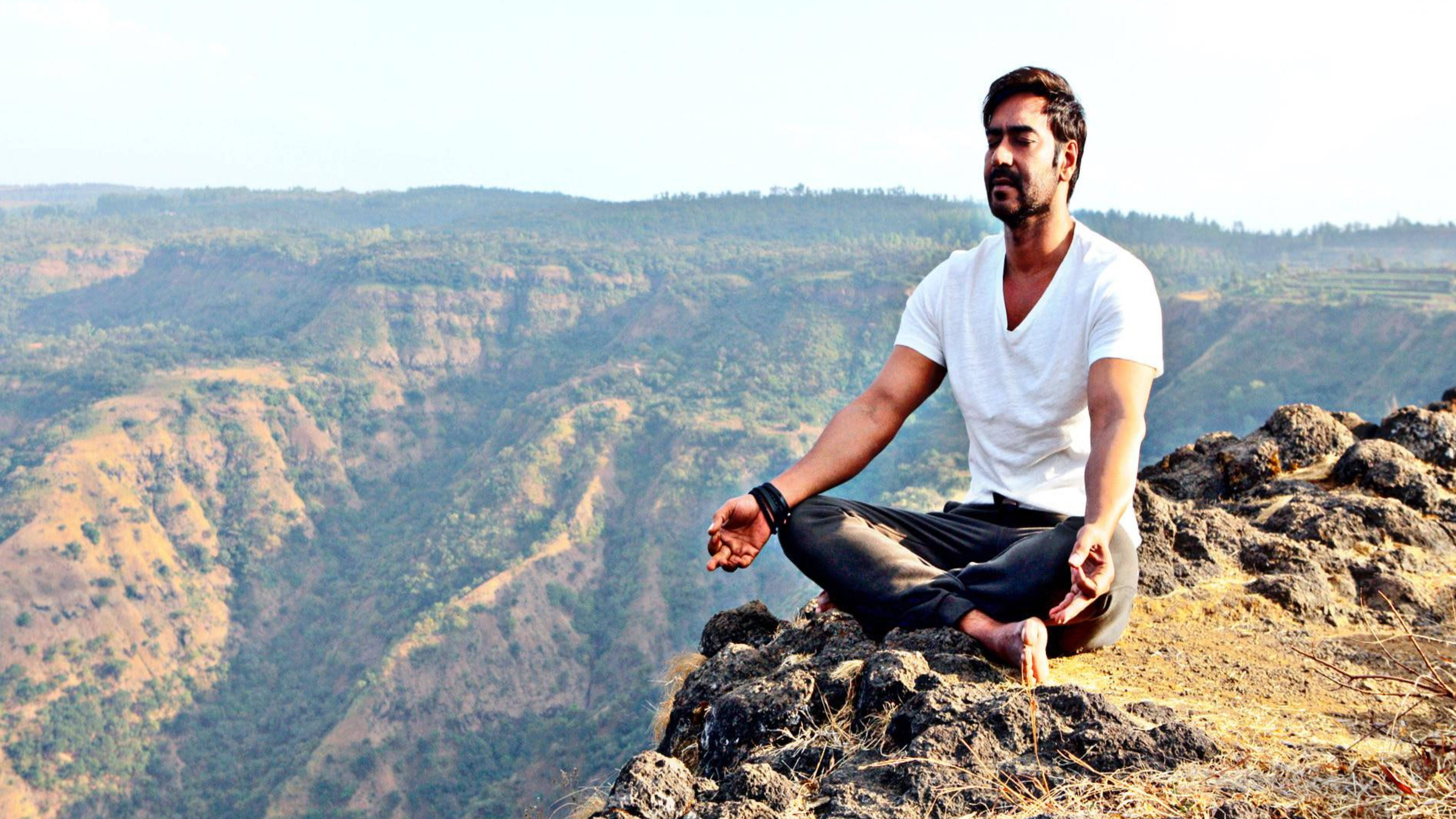 Ajay Devgn, Yoga, rocky cliff, 5K Desktop Wallpaper