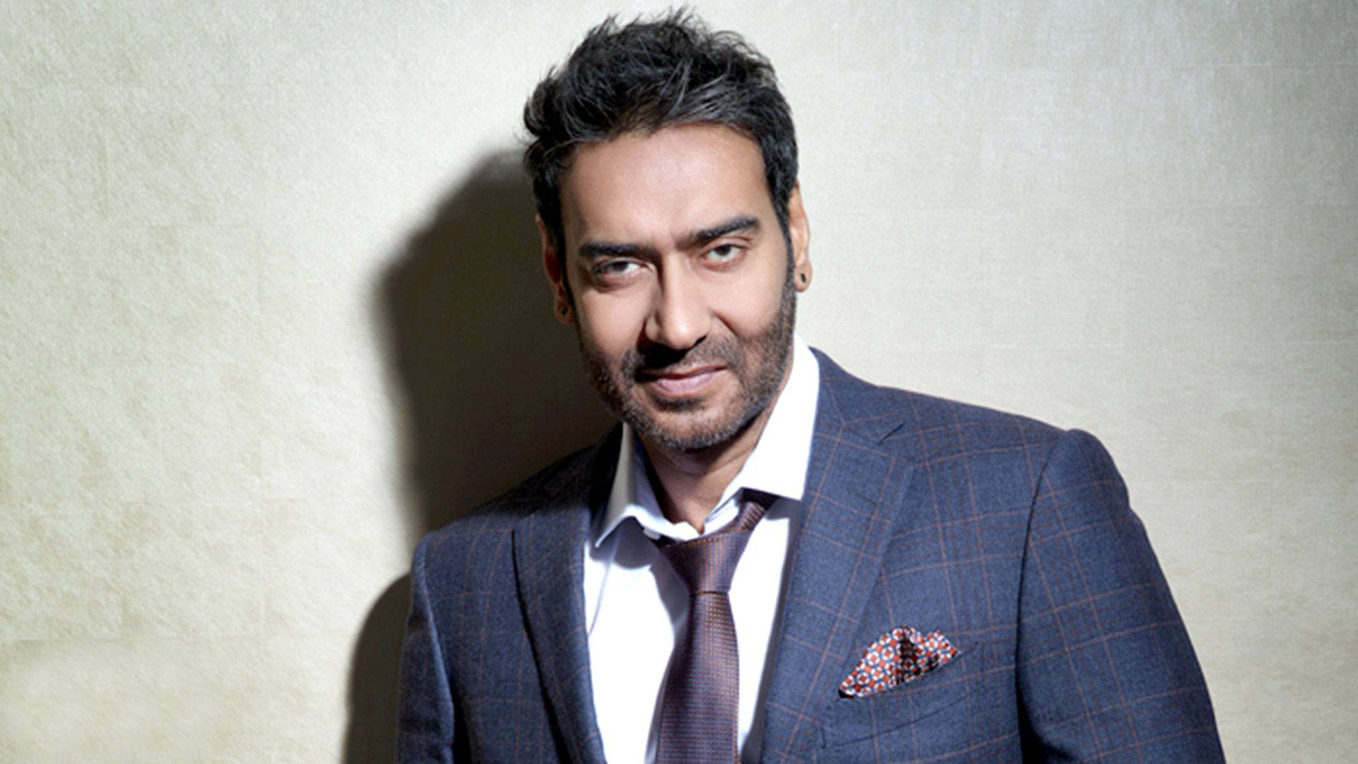 Ajay Devgn, dark blue plaid suit, textured wall, Full HD Desktop Wallpaper