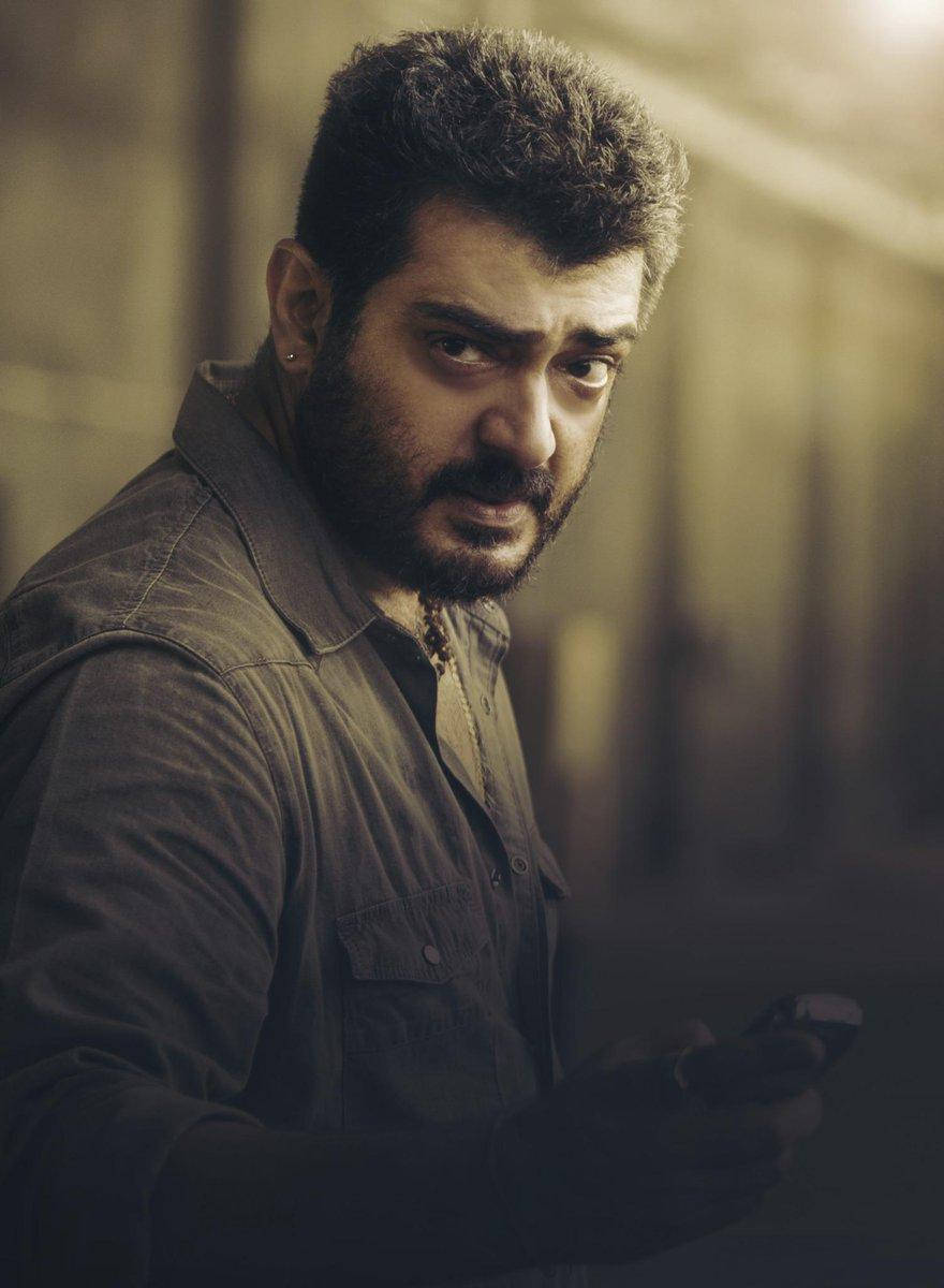 Ajith, raising eyebrow, dimly lit corridor, SD Phone Wallpaper