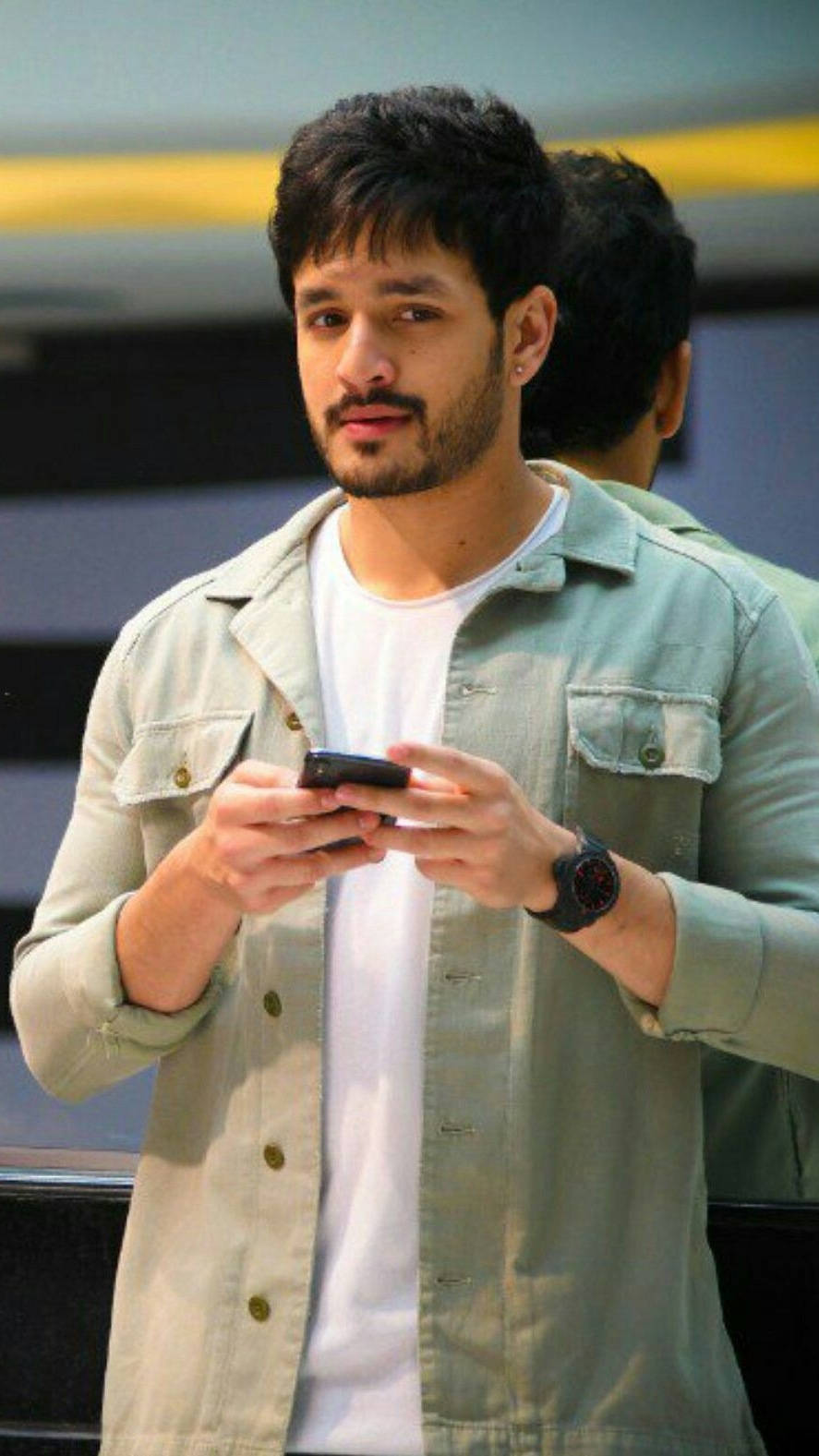 Akhil Akkineni, light green jacket, phone, HD Phone Wallpaper
