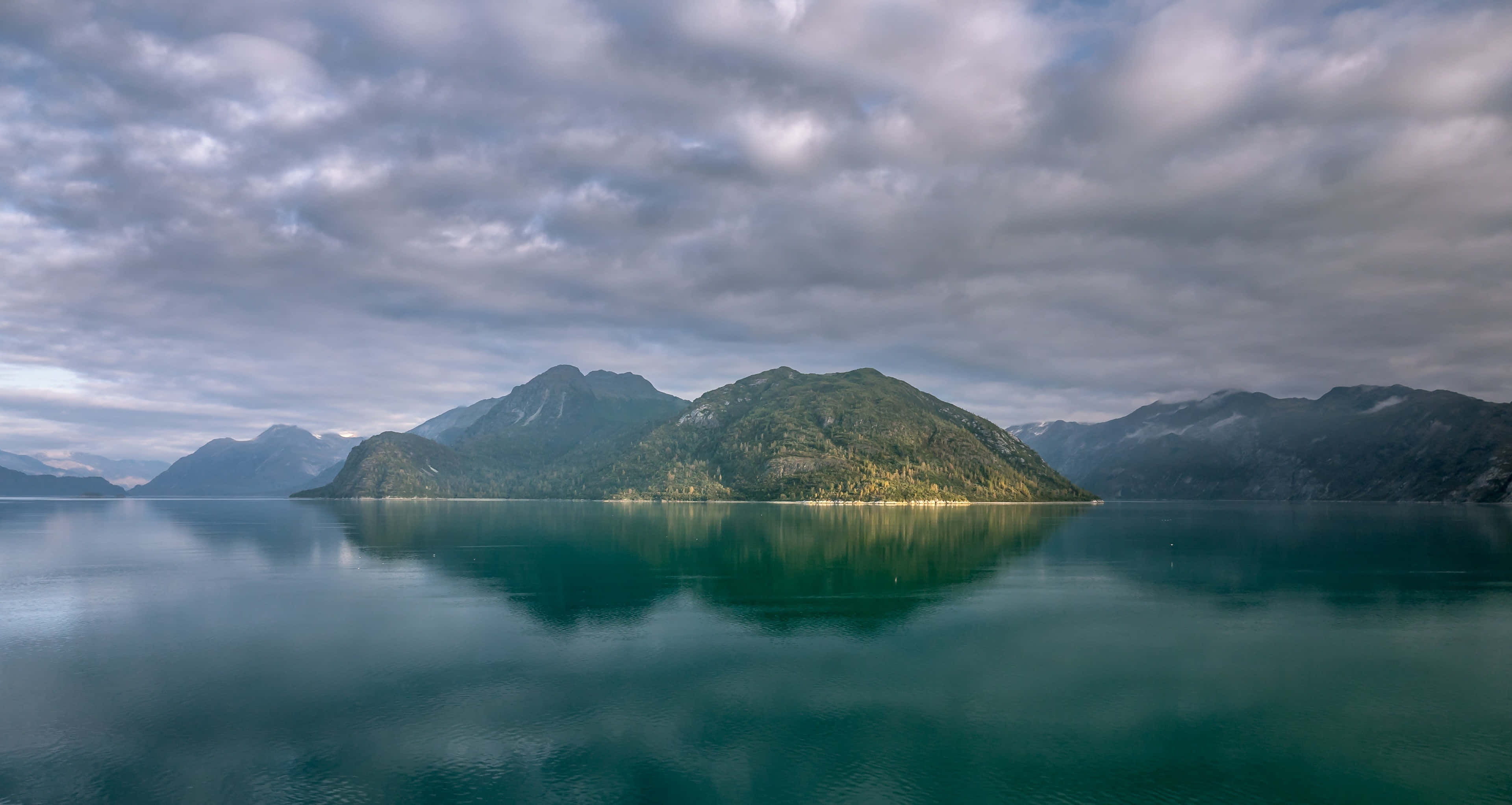 Alaskan mountain lake serenity, turquoise waters, soft cloudy sky, 4K Desktop Wallpaper
