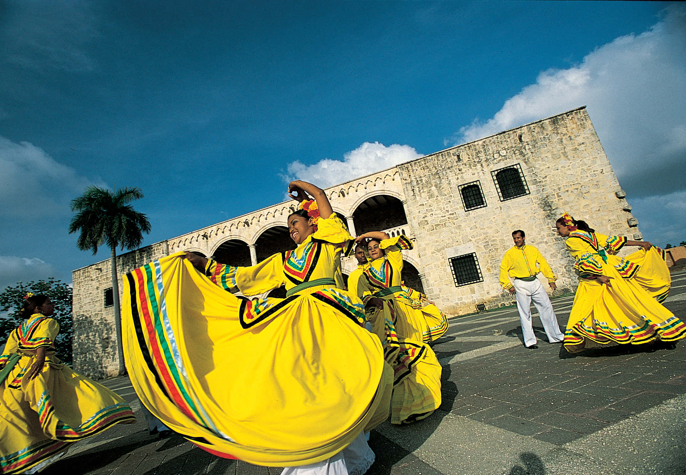 Alcazar De Colon, yellow costumed dancers, historic stone building, Full HD Desktop Wallpaper