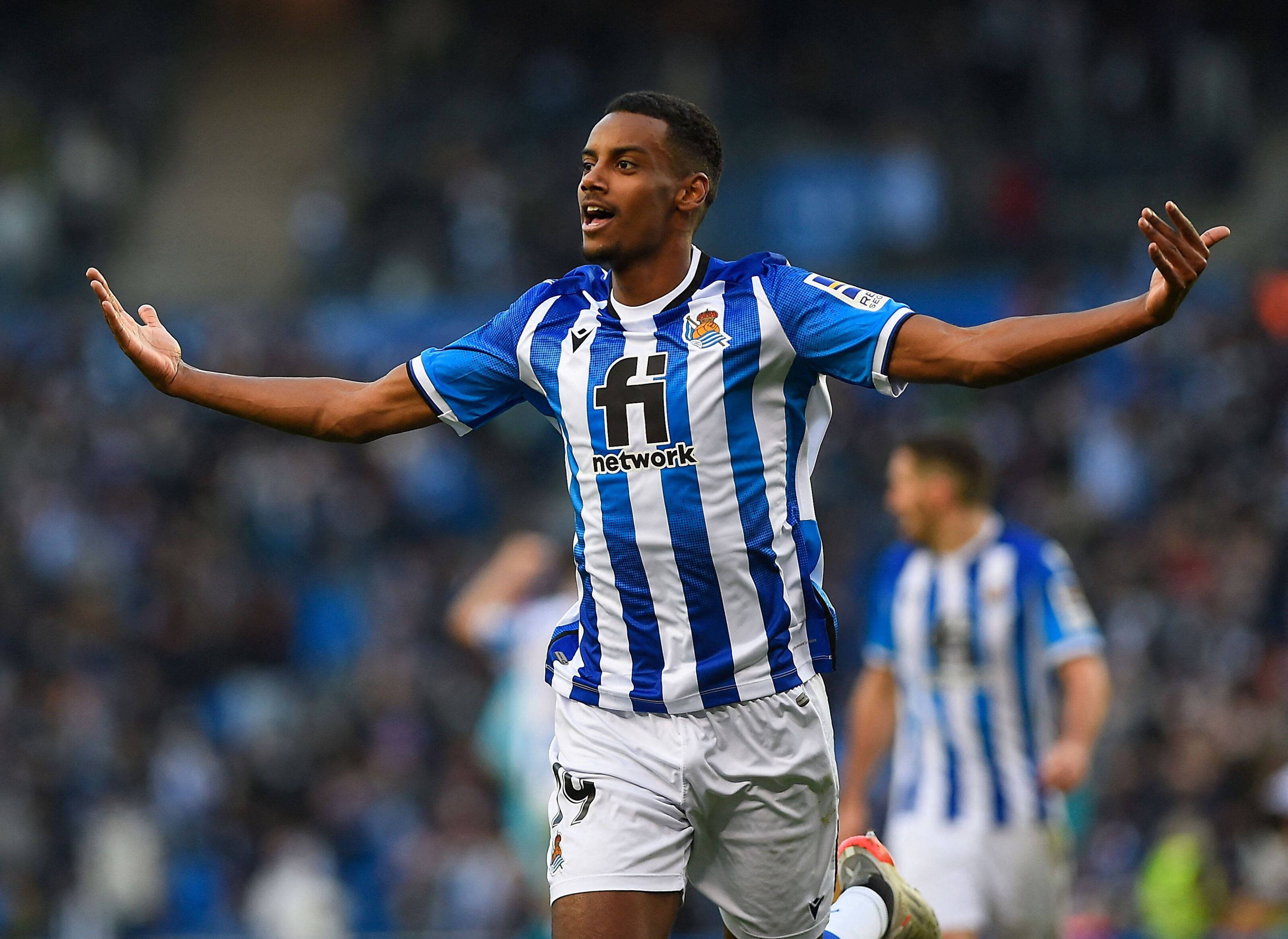 Alexander Isak, blue and white striped jersey, stadium field, 2K Desktop Wallpaper