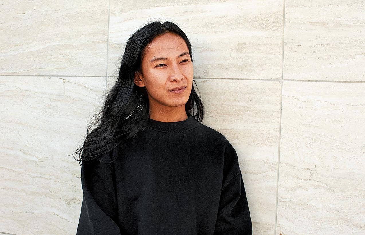 Alexander Wang, light beige tiled wall, black sweatshirt, SD Desktop Wallpaper
