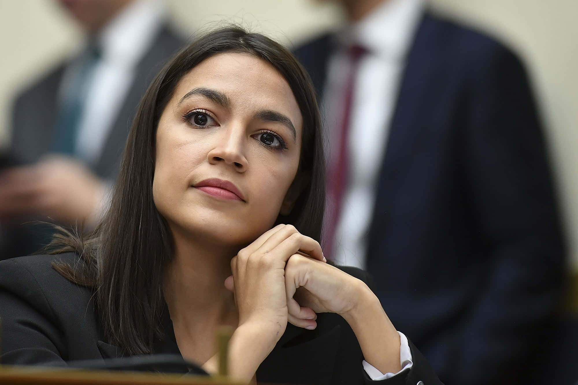 Alexandria Ocasio-cortez, dark suit, clasped hands, Full HD Desktop Wallpaper
