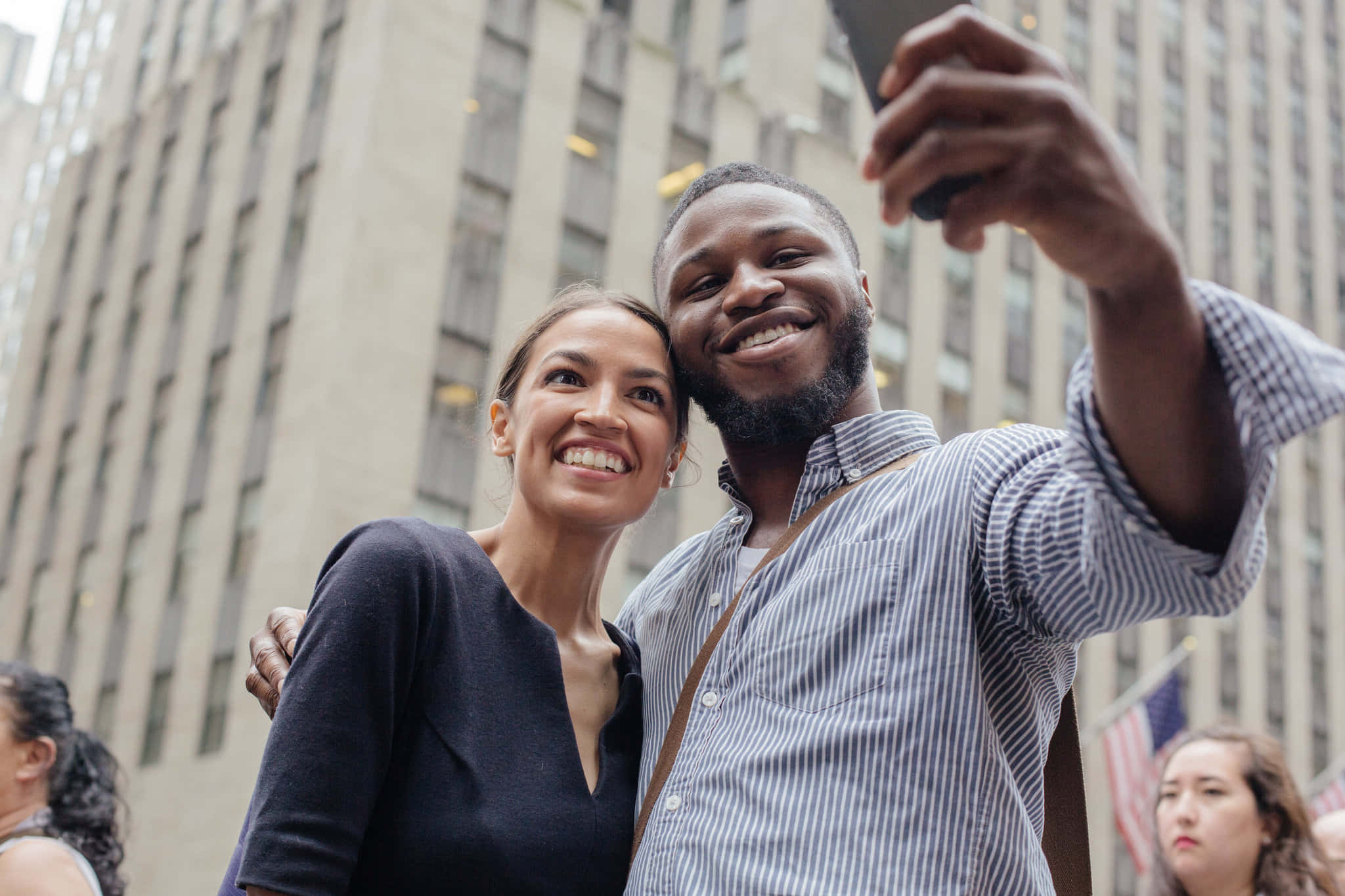 Alexandria Ocasio-cortez, selfie, bustling city street, Full HD Desktop Wallpaper