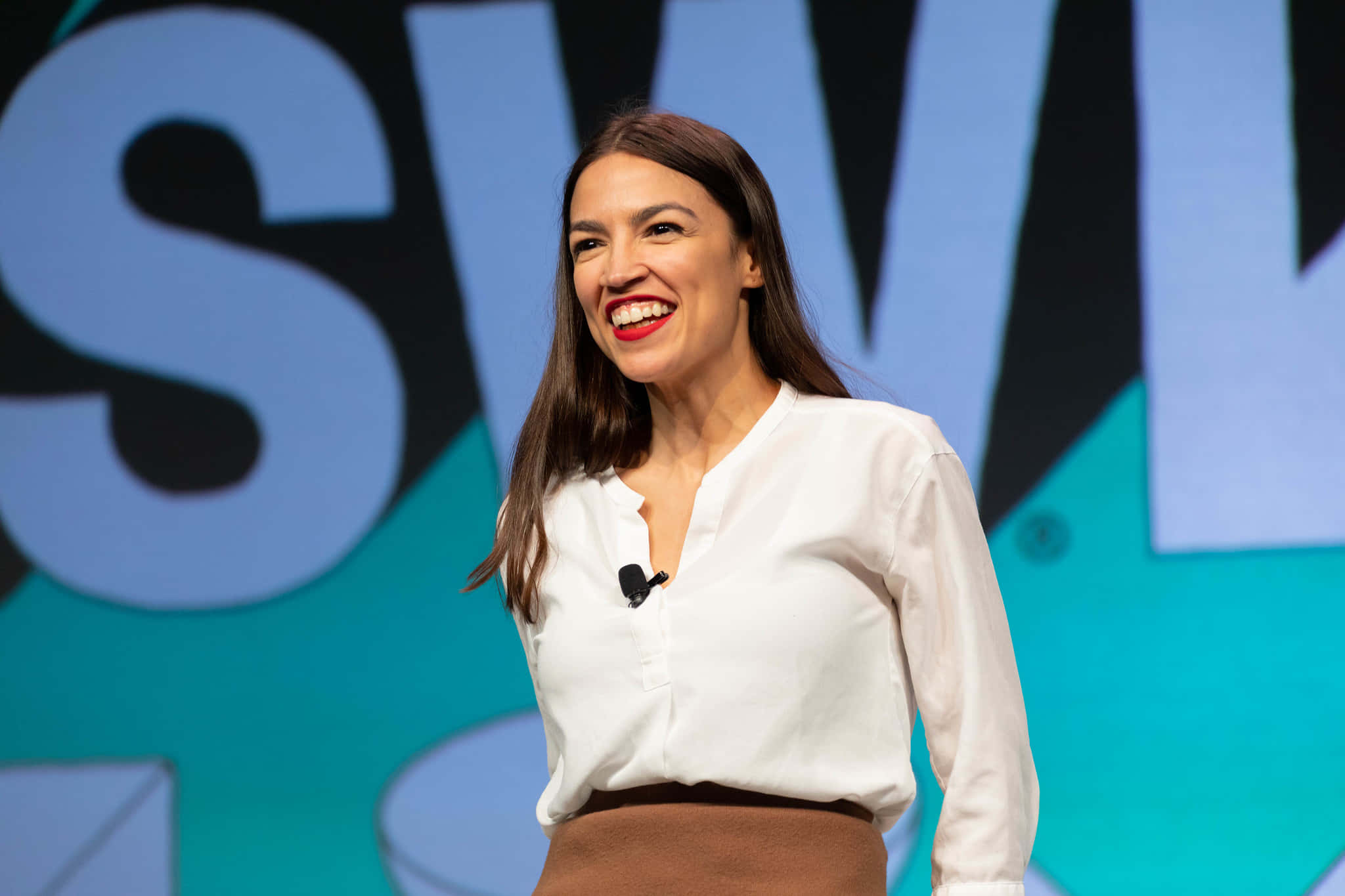 Alexandria Ocasio-cortez, blue and teal graphic backdrop, stage, Full HD Desktop Wallpaper
