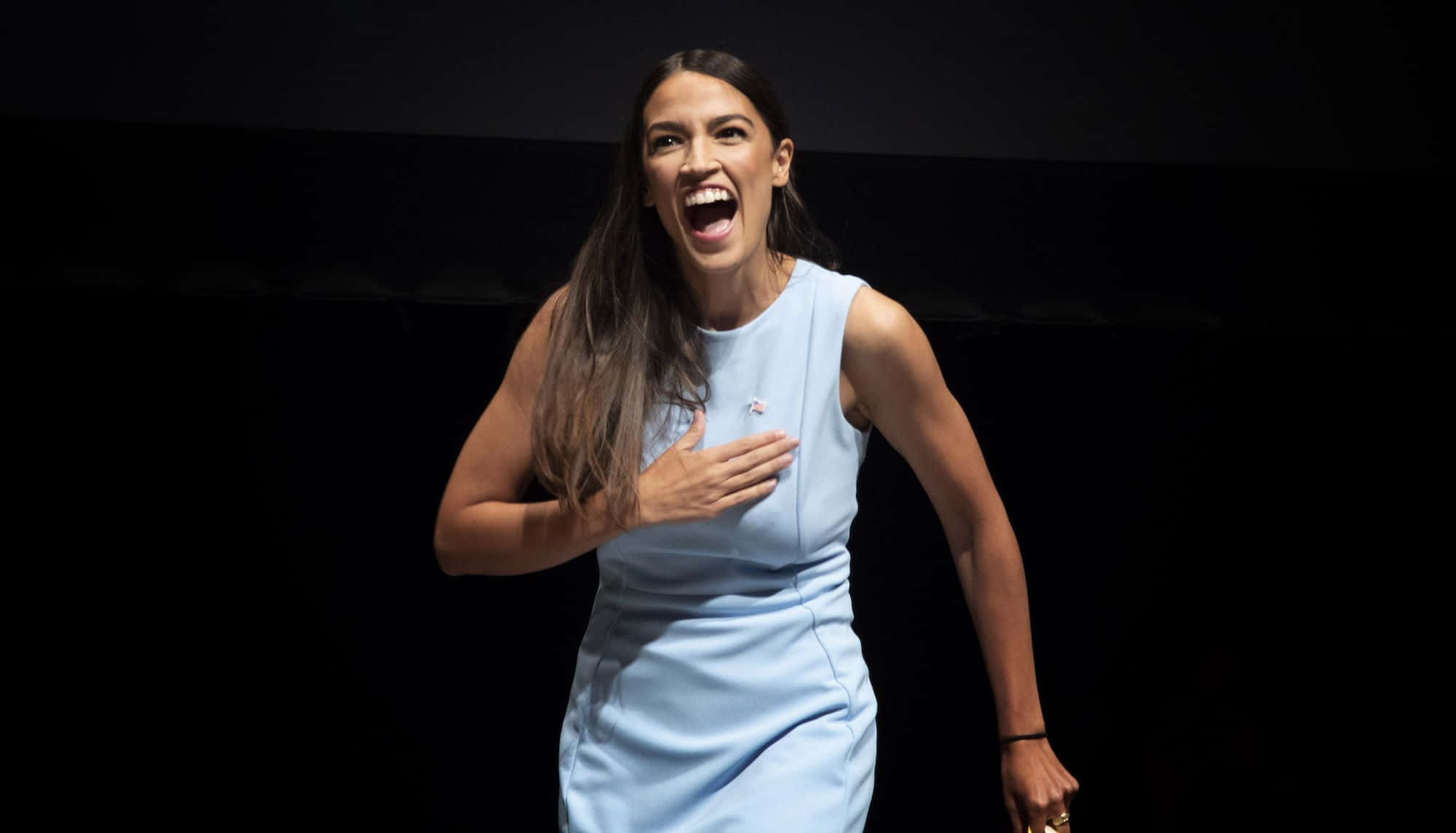 Alexandria Ocasio-cortez, light blue dress, dark background, Full HD Desktop Wallpaper