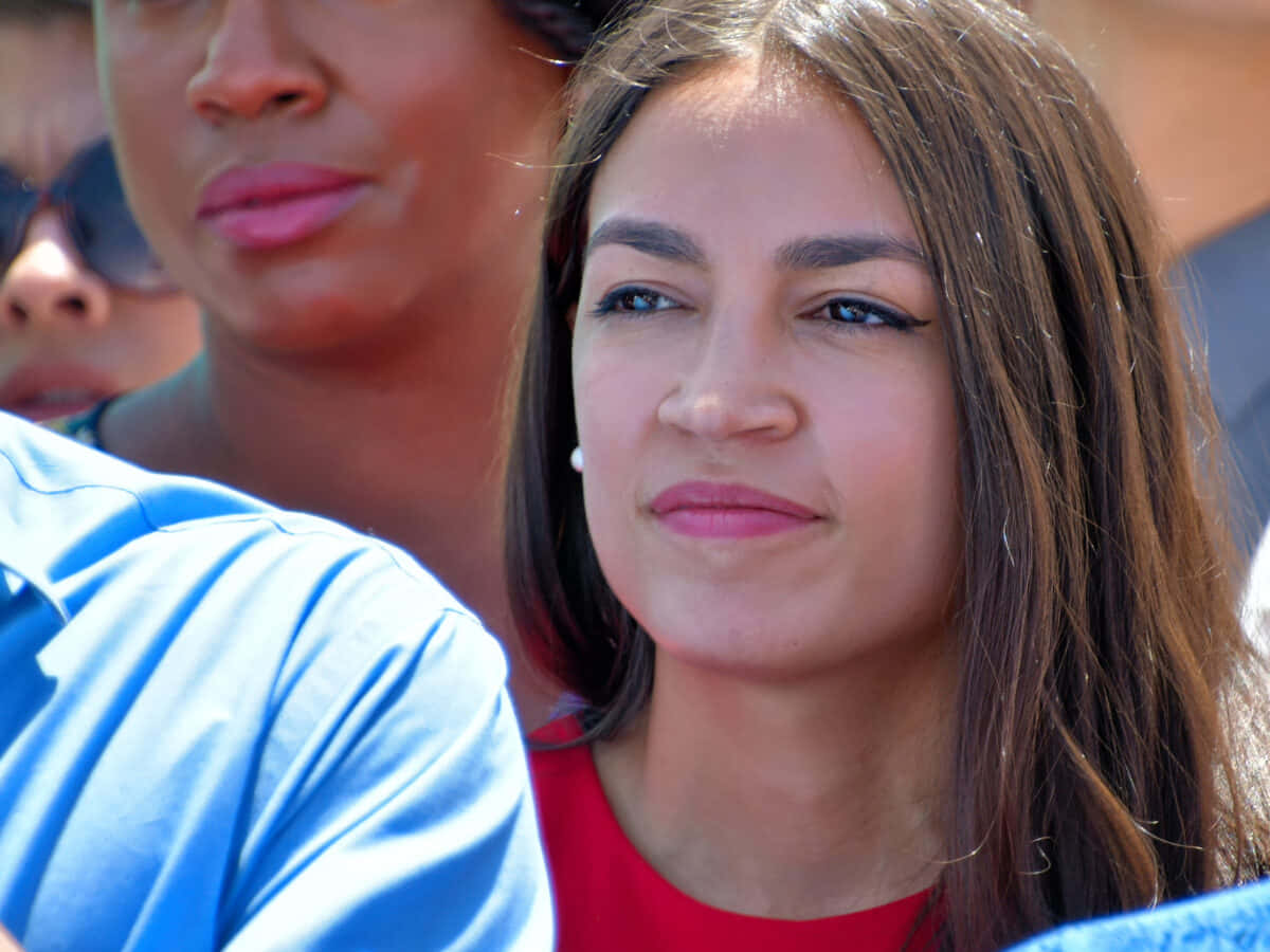 Alexandria Ocasio-cortez, red top, long brown hair, SD Desktop Wallpaper