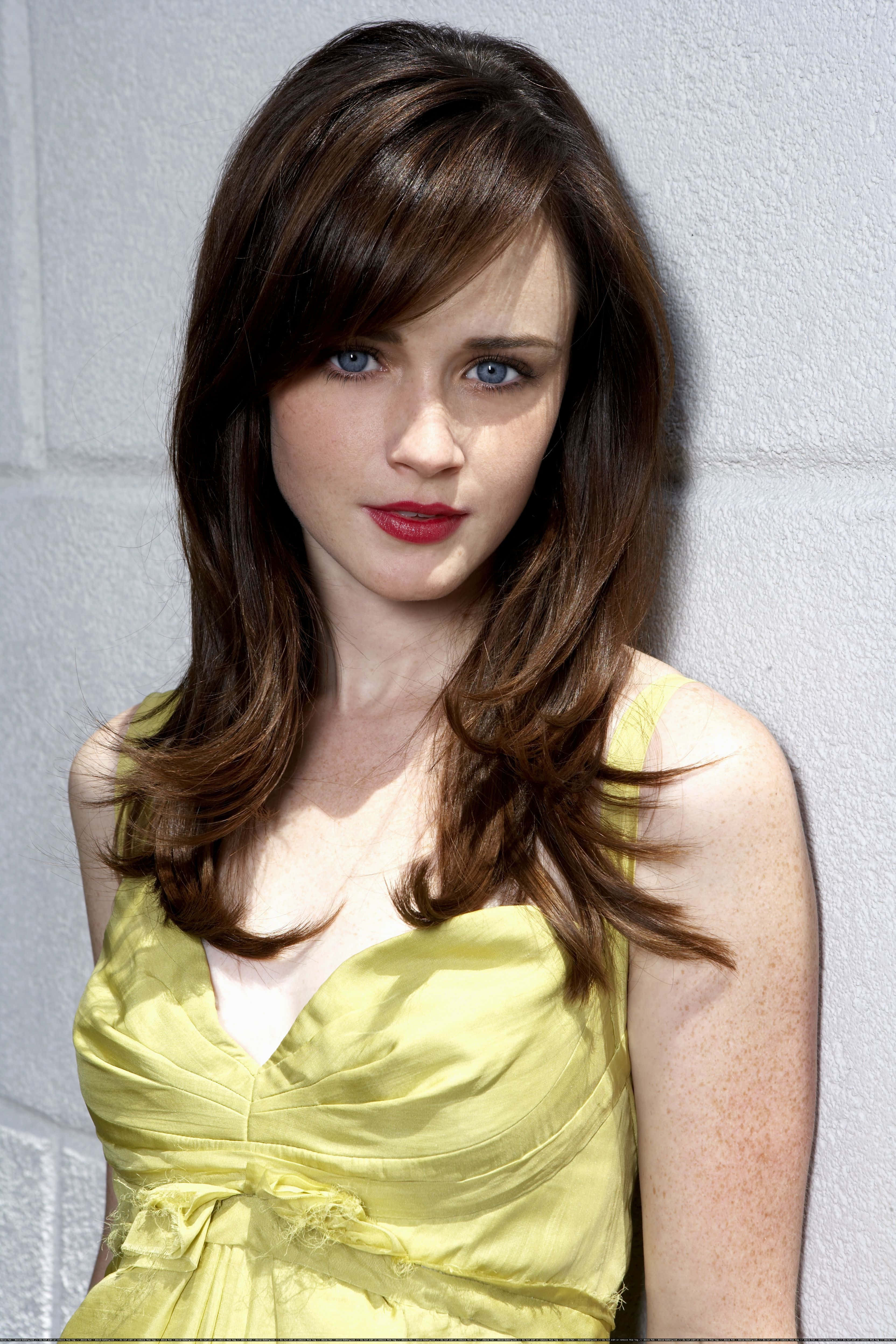 Alexis Bledel, yellow dress, light gray brick wall, 4K Phone Wallpaper