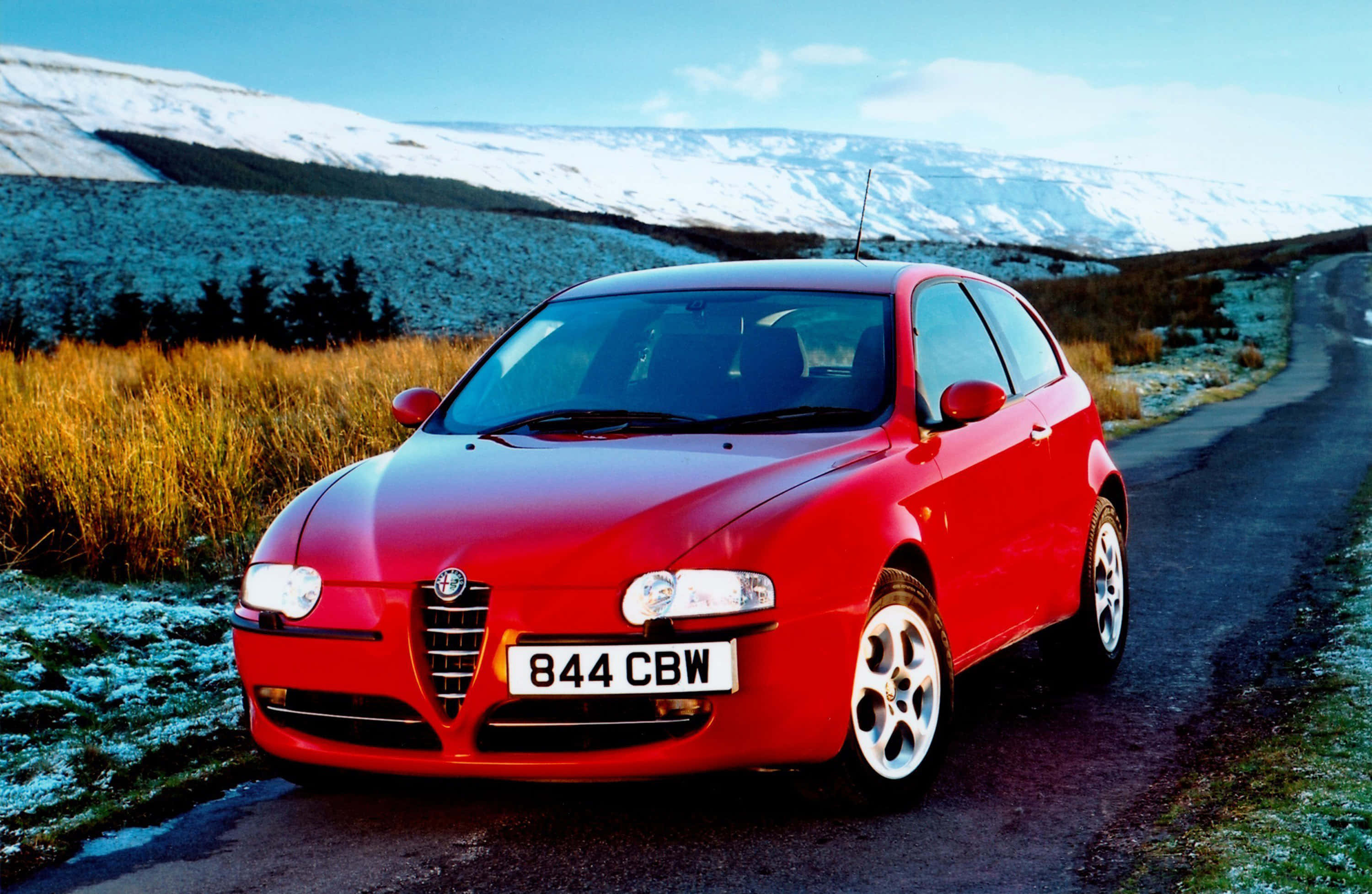 Alfa Romeo 147, vibrant red, winding road, 2K Desktop Wallpaper