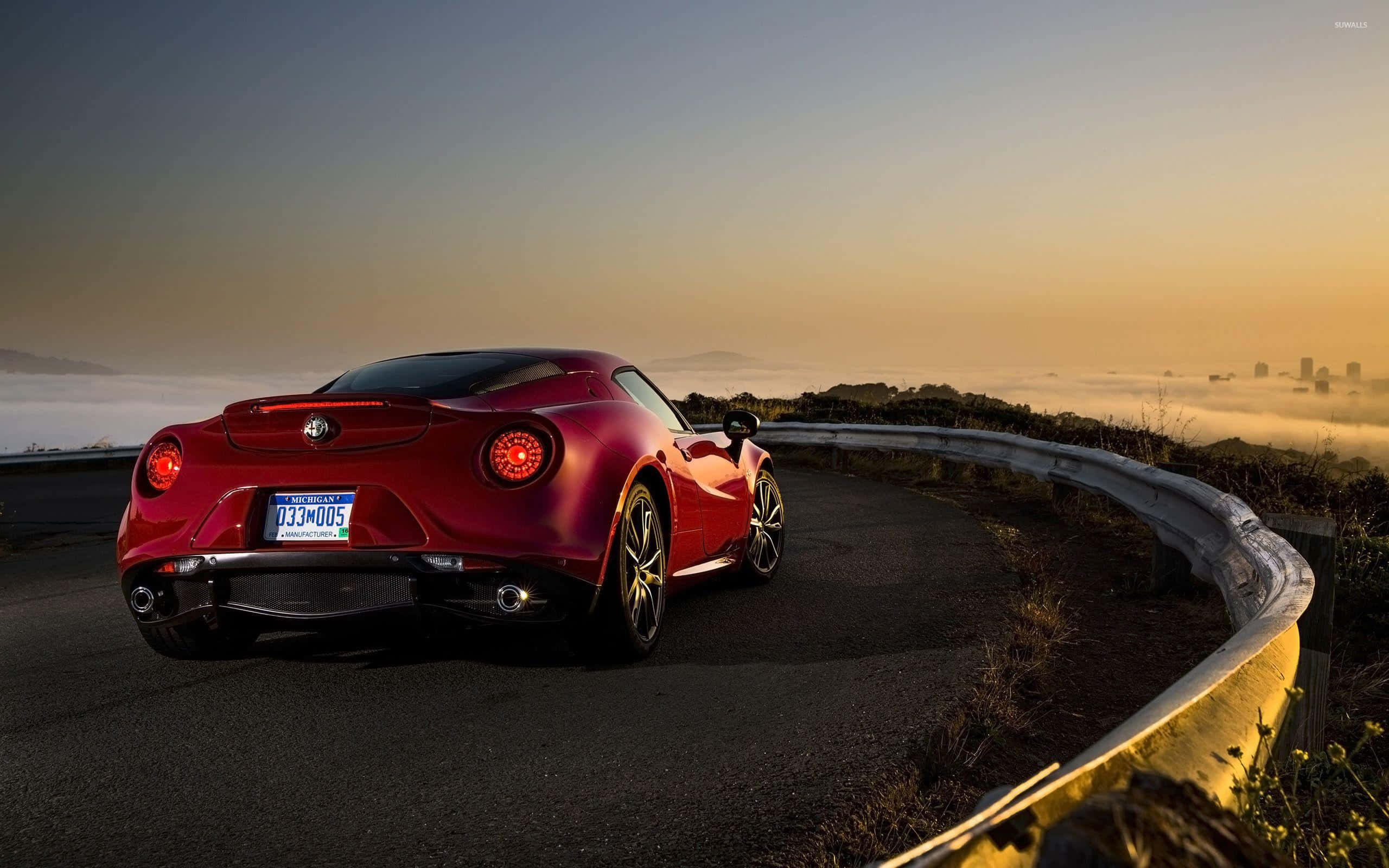 Alfa Romeo 4C, glossy red, winding coastal road, 2K Desktop Wallpaper