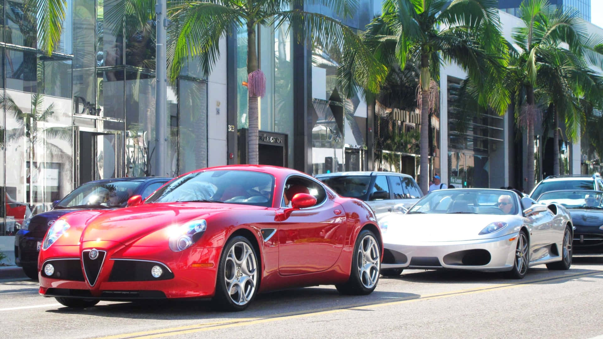 Alfa Romeo 8C Competizione, vibrant red, palm tree-lined urban street, Full HD Desktop Wallpaper
