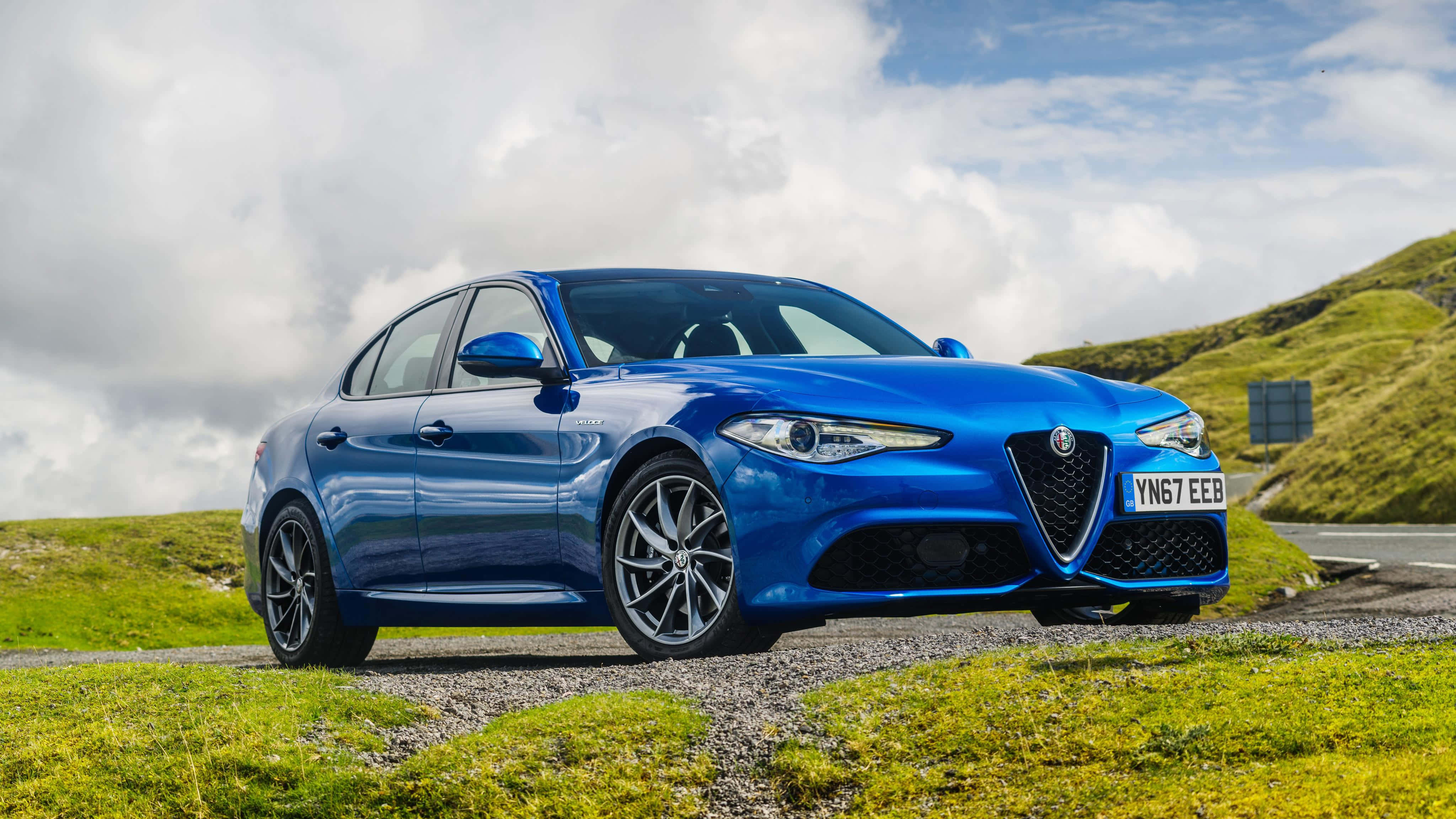 Alfa Romeo Giulia, vibrant blue, gravel road, 4K Desktop Wallpaper