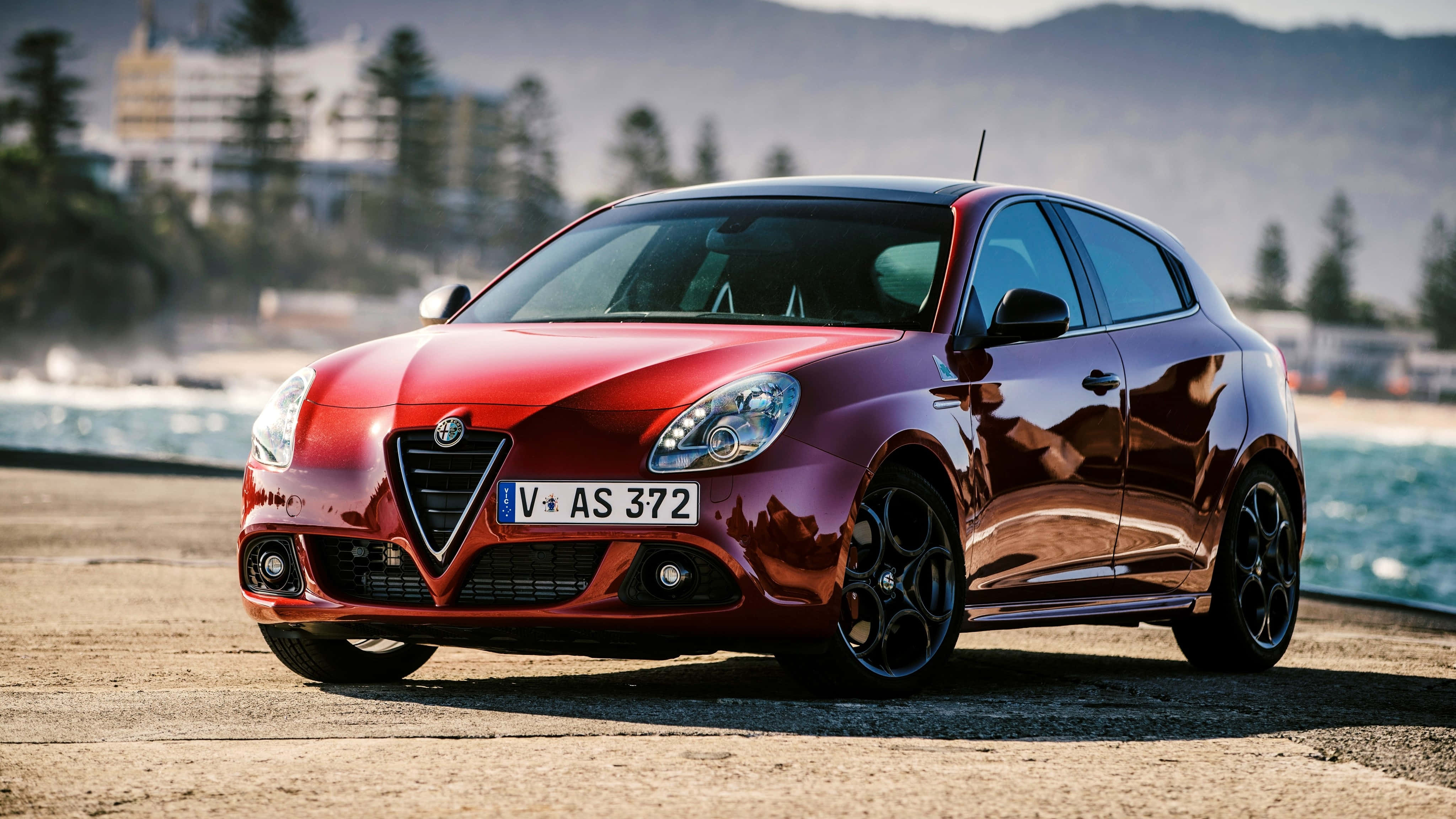 Alfa Romeo Giulietta, glossy red, coastal road, 4K Desktop Wallpaper