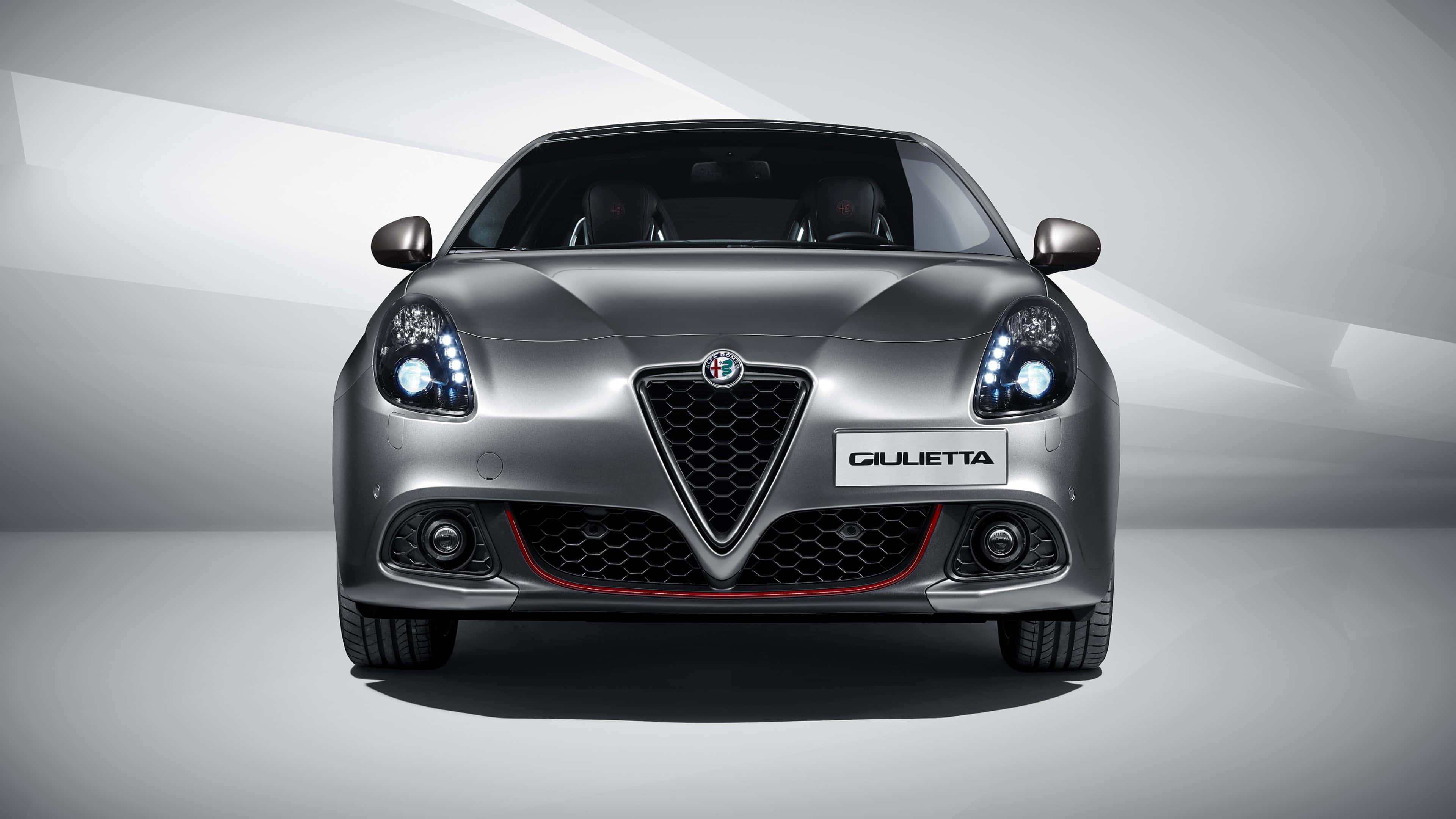 Alfa Romeo Giulietta, sleek silver, glowing headlights, 4K Desktop Wallpaper