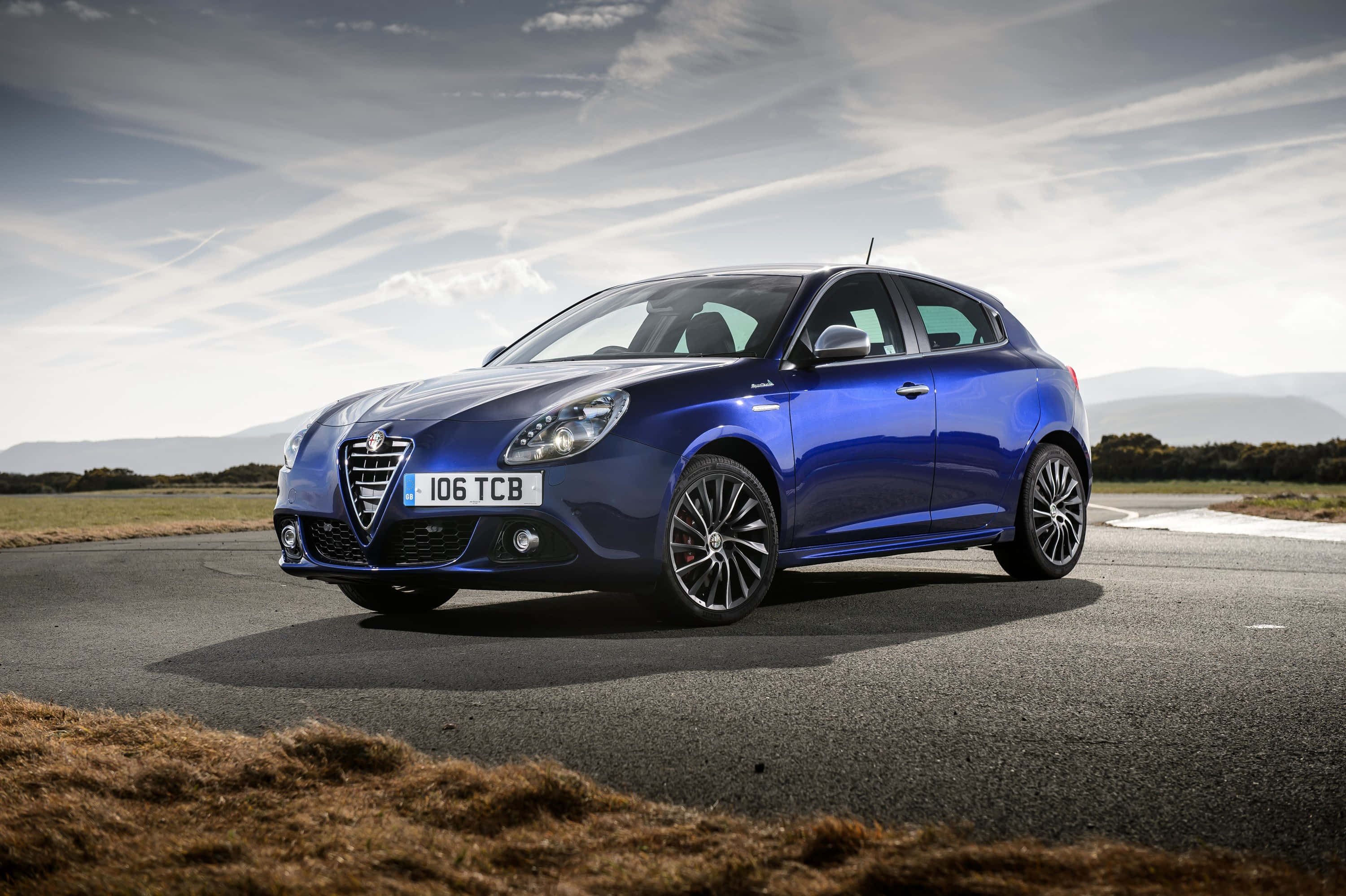 Alfa Romeo Giulietta, glossy blue, winding road, 2K Desktop Wallpaper