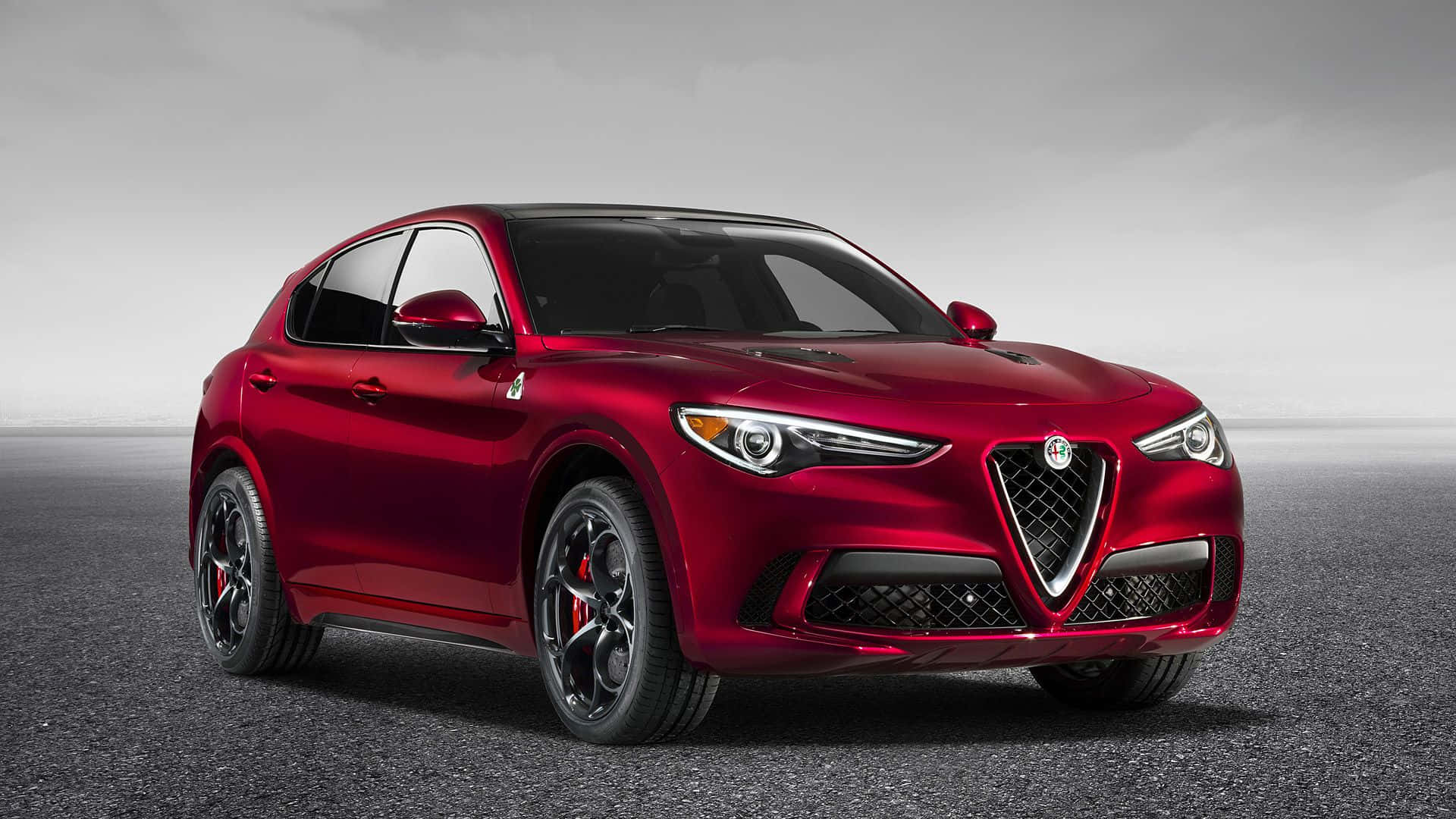 Alfa Romeo Stelvio, glossy red, minimalist gray asphalt surface, Full HD Desktop Wallpaper