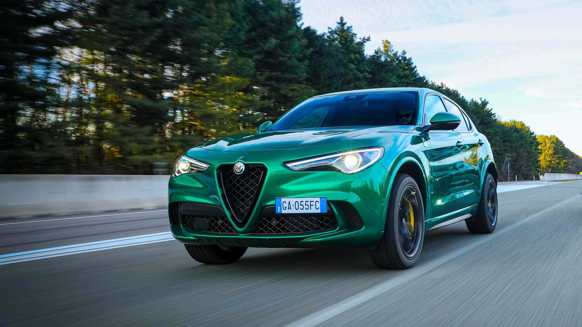 Alfa Romeo Stelvio, vibrant green, tree-lined road, Full HD Desktop Wallpaper