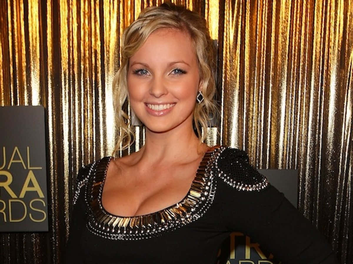 Alicia Banit, black bejeweled dress, shimmering gold curtain backdrop, SD Desktop Wallpaper