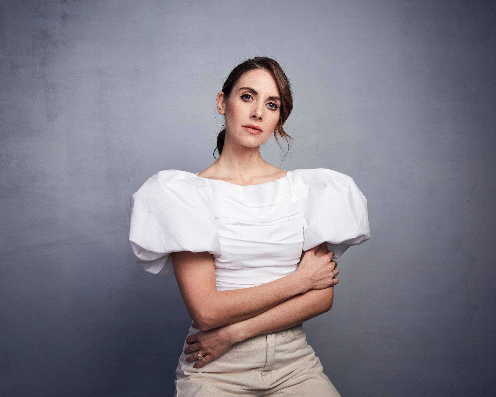 Alison Brie, white puff-sleeve top, textured gray backdrop, Full HD Desktop Wallpaper