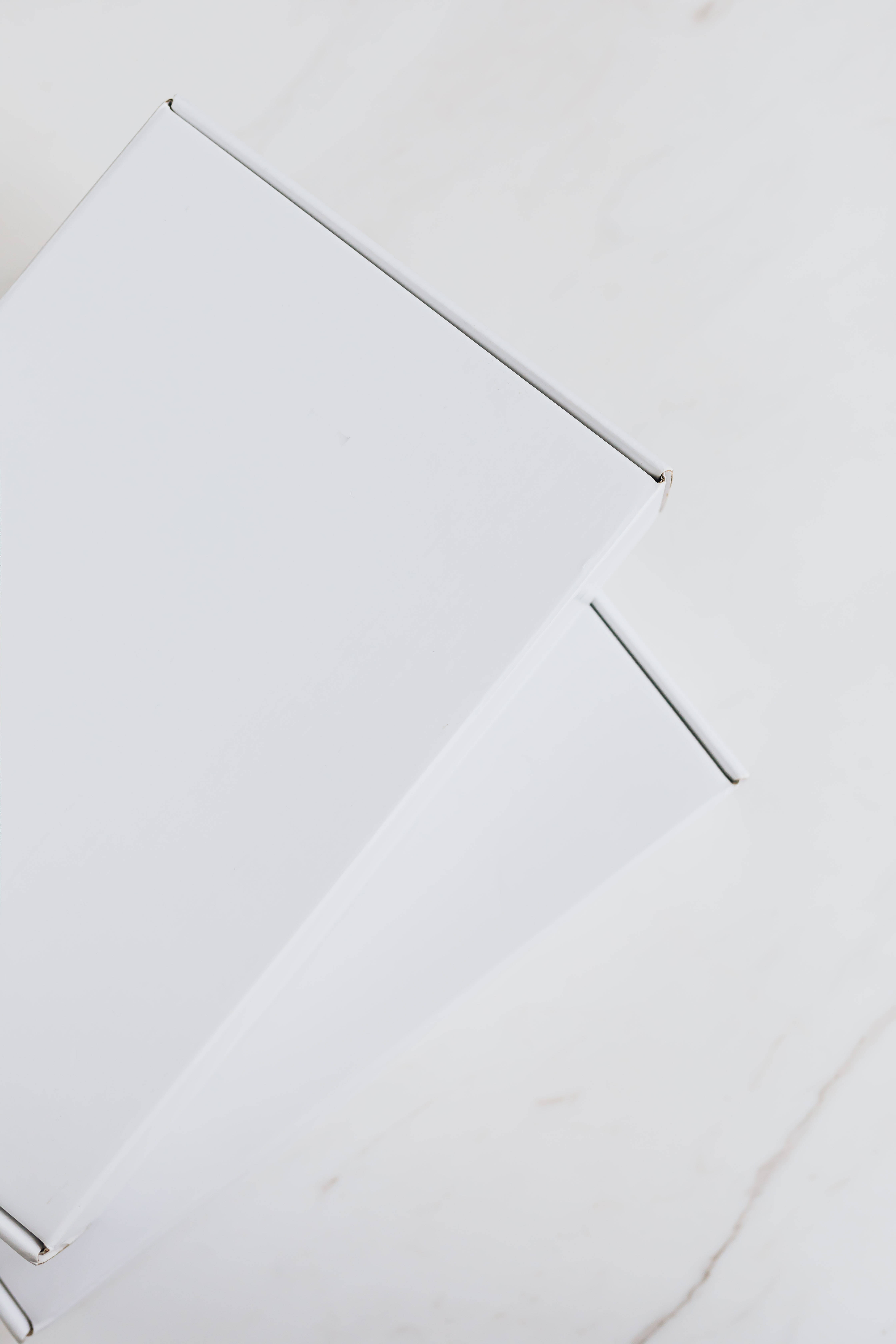white box, marble surface, soft shadows, 5K Phone Wallpaper